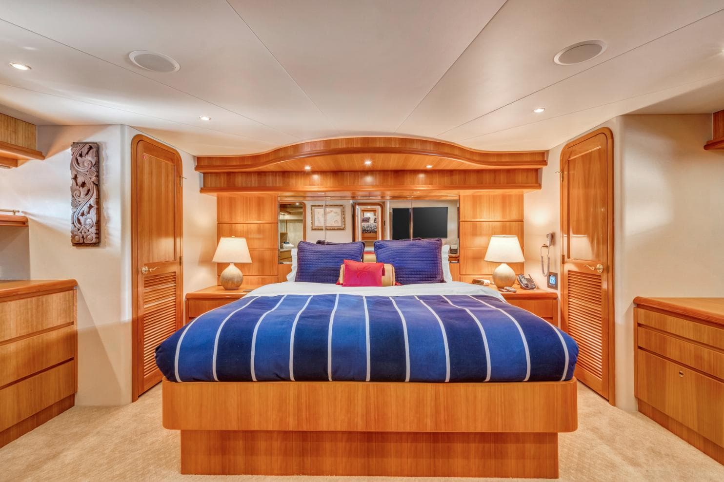 Luxurious 2007 West Bay Yacht Fisherman bedroom with elegant wood finish and cozy bedding.