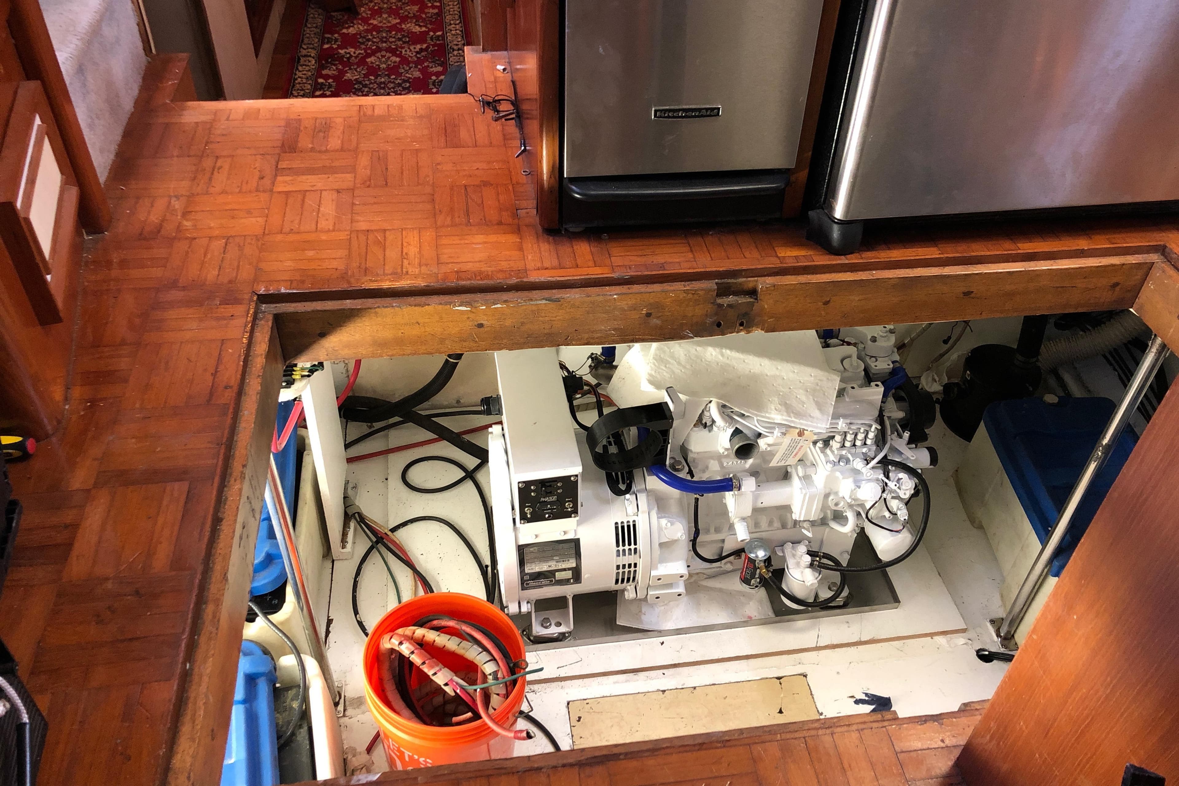 Engine room of 1988 Jefferson Marquessa 60 MY yacht with parquet flooring and equipment.