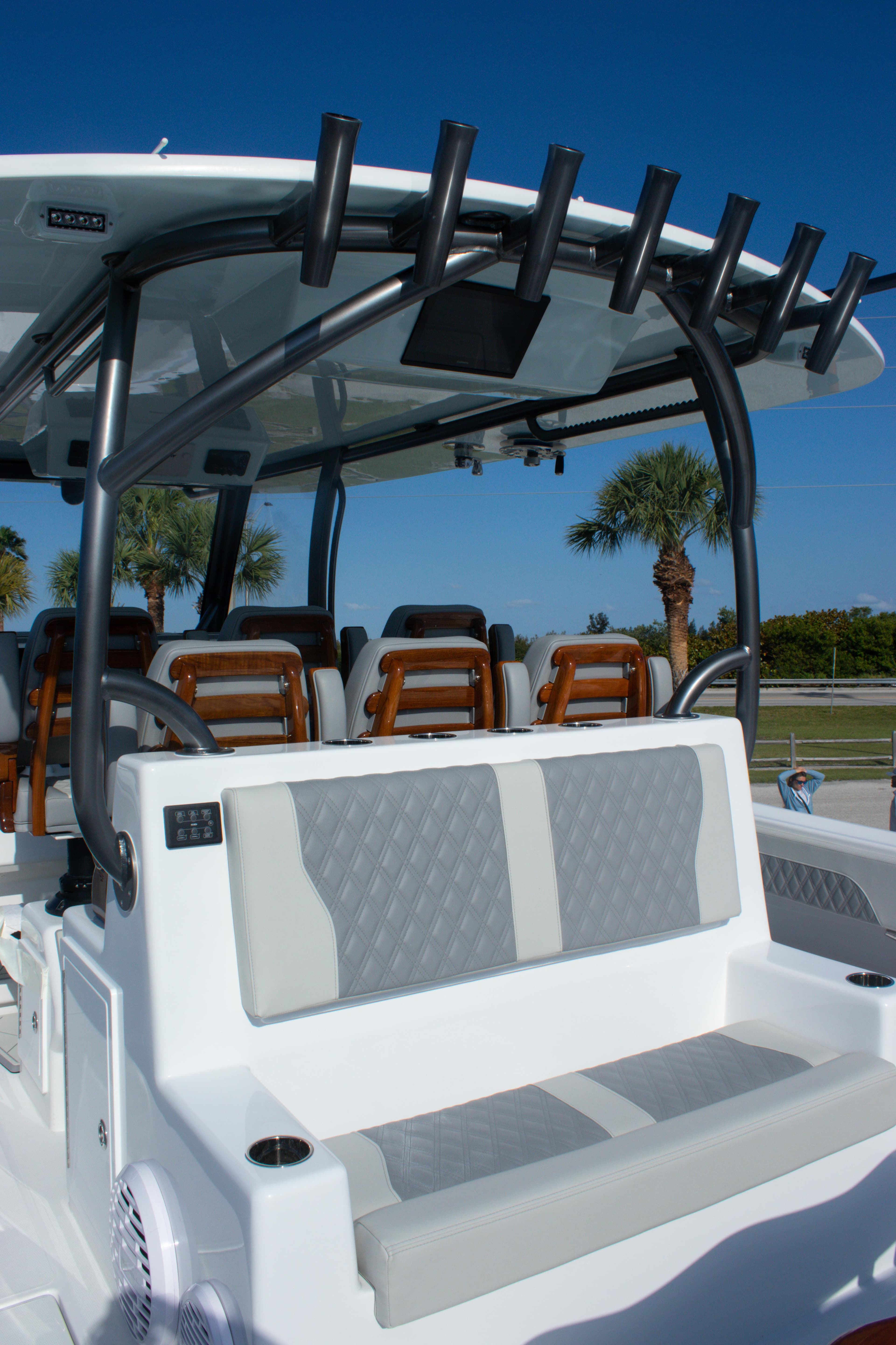 2026 Front Runner 43 Catamaran with seating and rod holders, under clear blue sky.