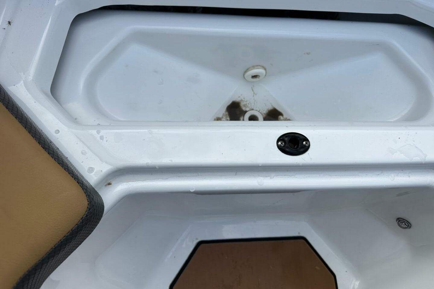 2021 Scarab 215 boat interior detail with white and tan surfaces.