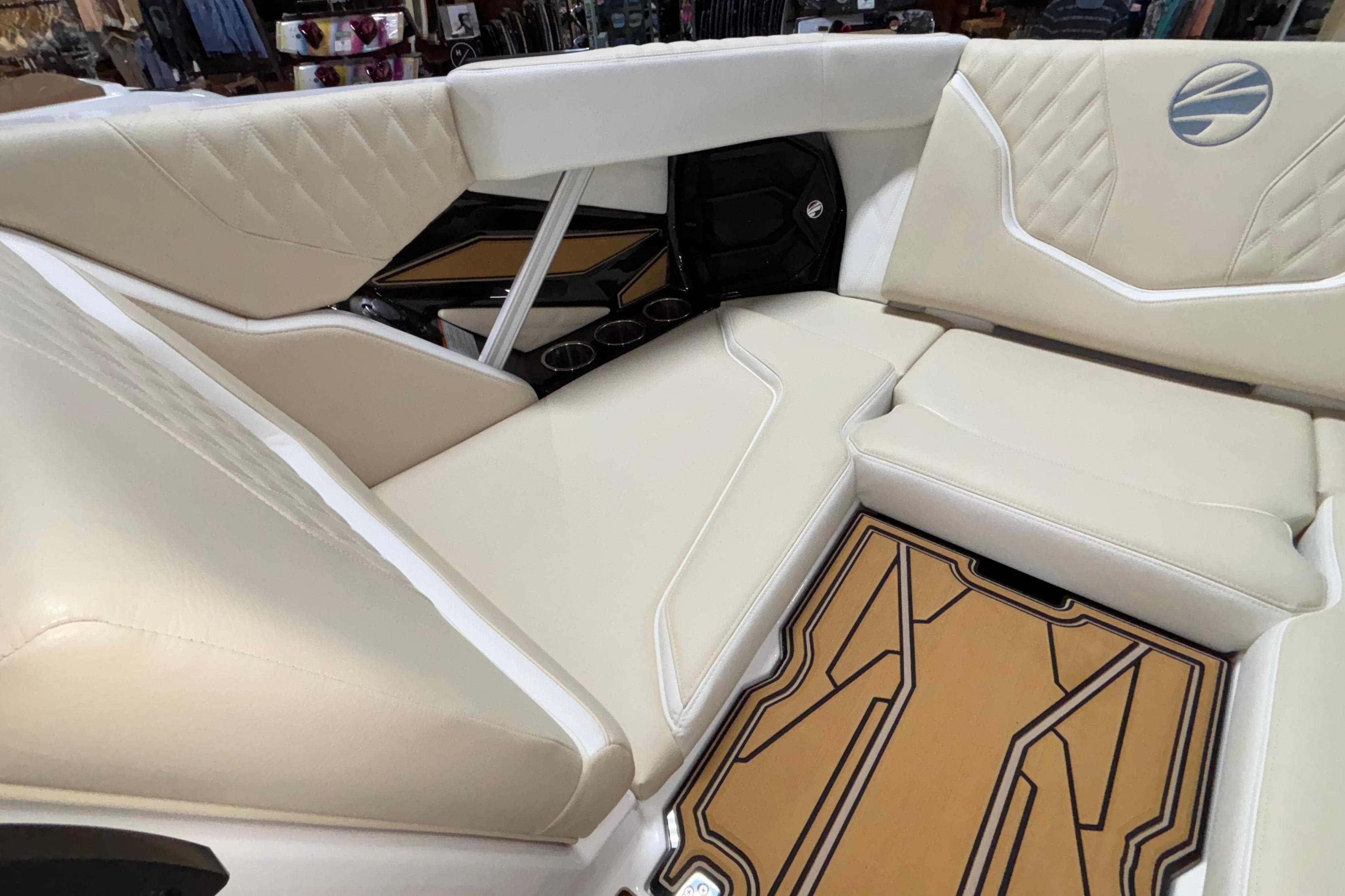 Luxurious interior of 2026 Tigé 22RZX boat with beige seating and stylish flooring.