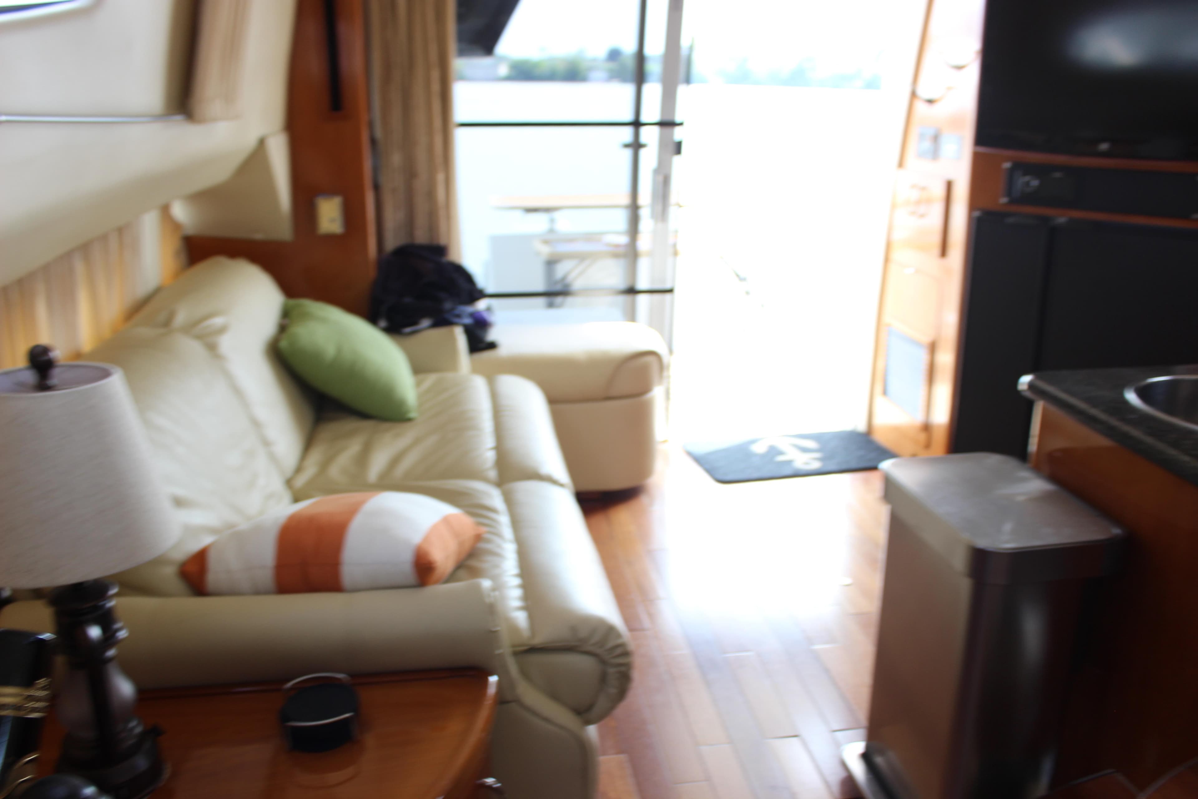 Interior of 2003 Carver 36 Super Sport yacht with cozy seating and modern amenities.