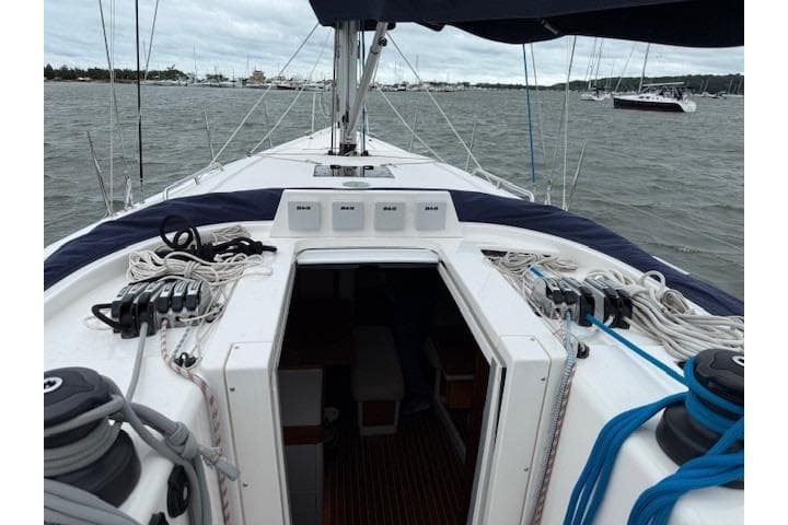 2016 X-Yachts XP-44 sailboat deck view with rigging and open cabin entrance.
