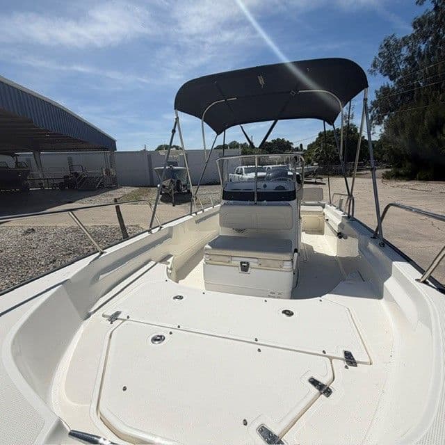 2018 Boston Whaler 170 Montauk boat with canopy outdoors.