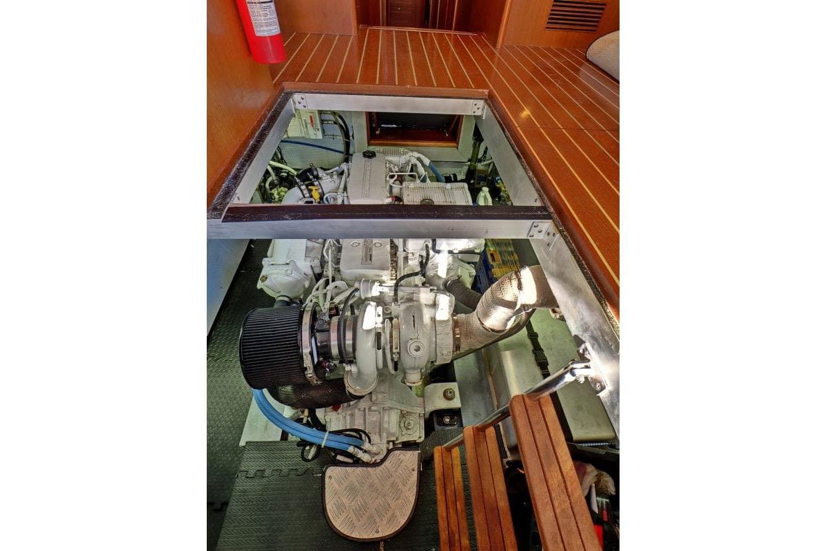 Engine room of 2016 North Pacific 45 Pilothouse yacht, showcasing detailed machinery.