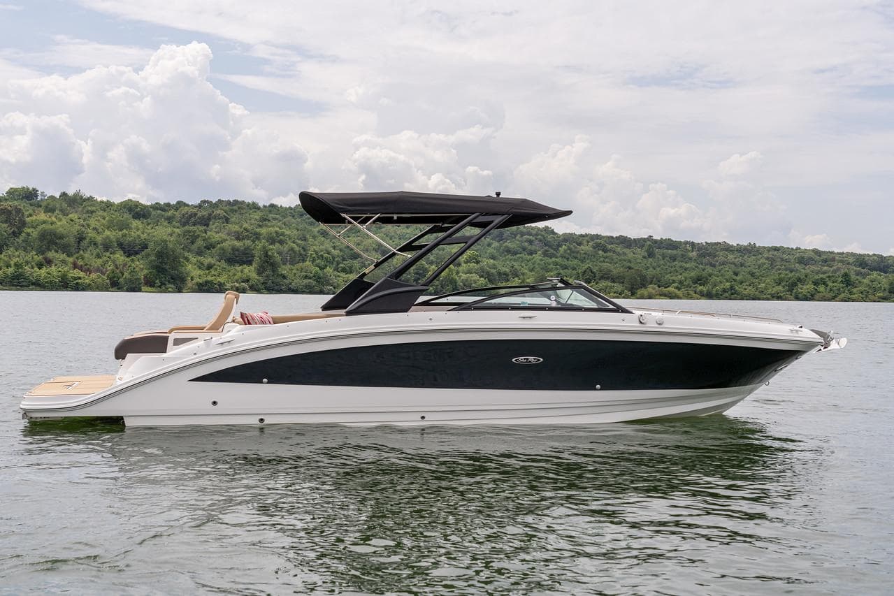 Manufacturer Provided Image: 2024 Sea Ray SDX 290 boat on a lake with lush green background.