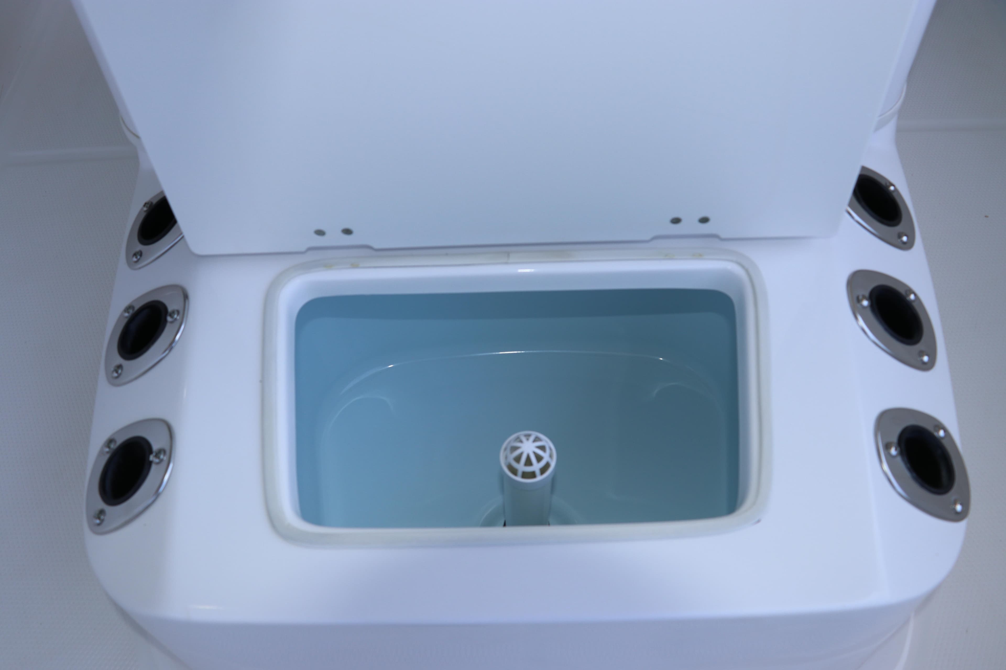 Livewell compartment on 2026 Robalo R160 Center Console boat, featuring multiple rod holders.