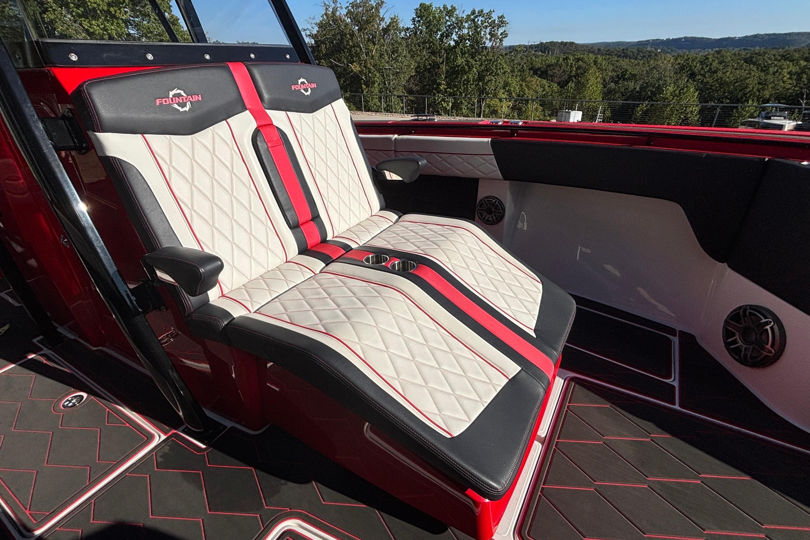 Luxurious seating on 2021 Fountain 38 SC boat with red and white upholstery.