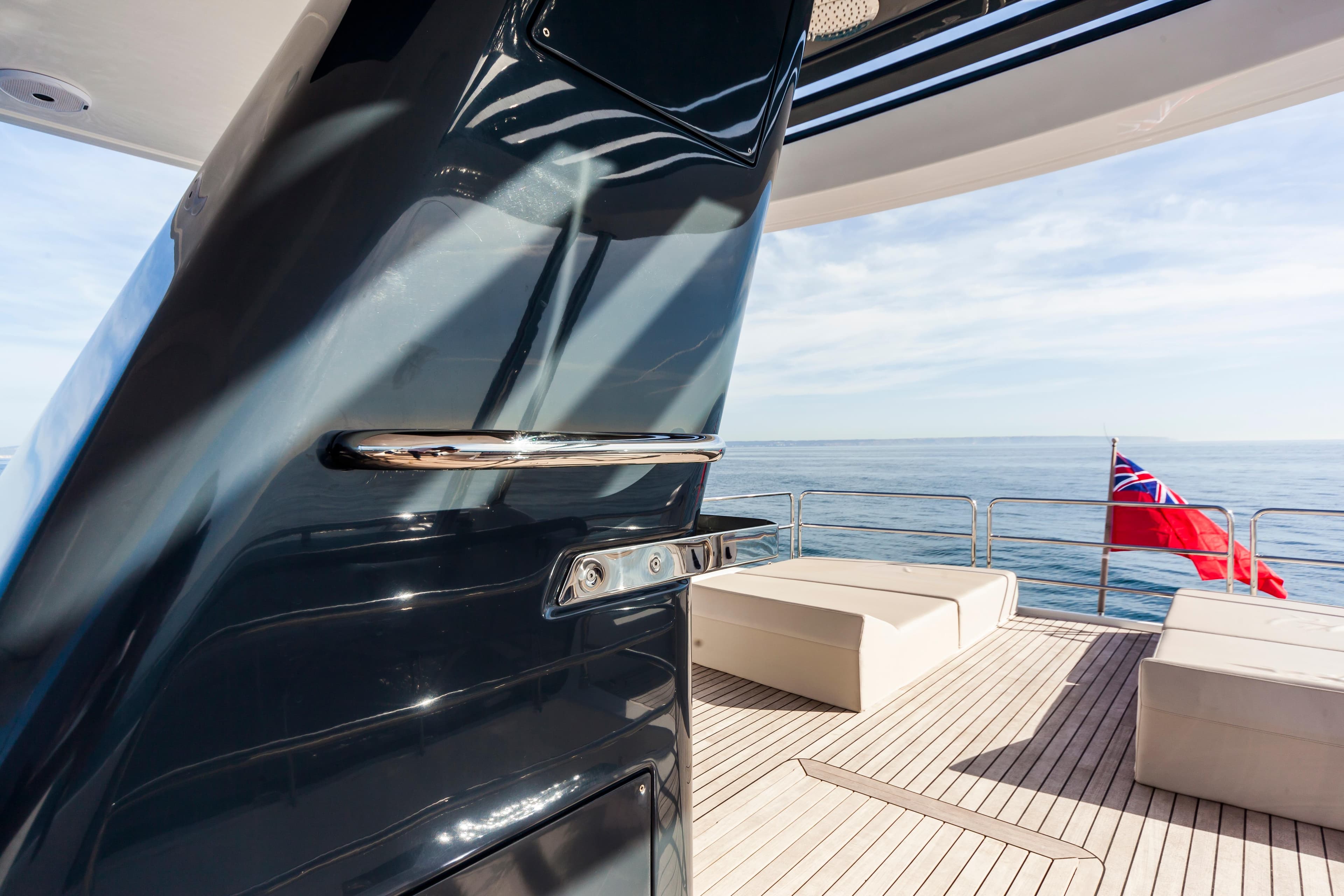 Luxurious Sirena 64 yacht deck with ocean view, featuring sleek design and comfortable seating, 2019 model.