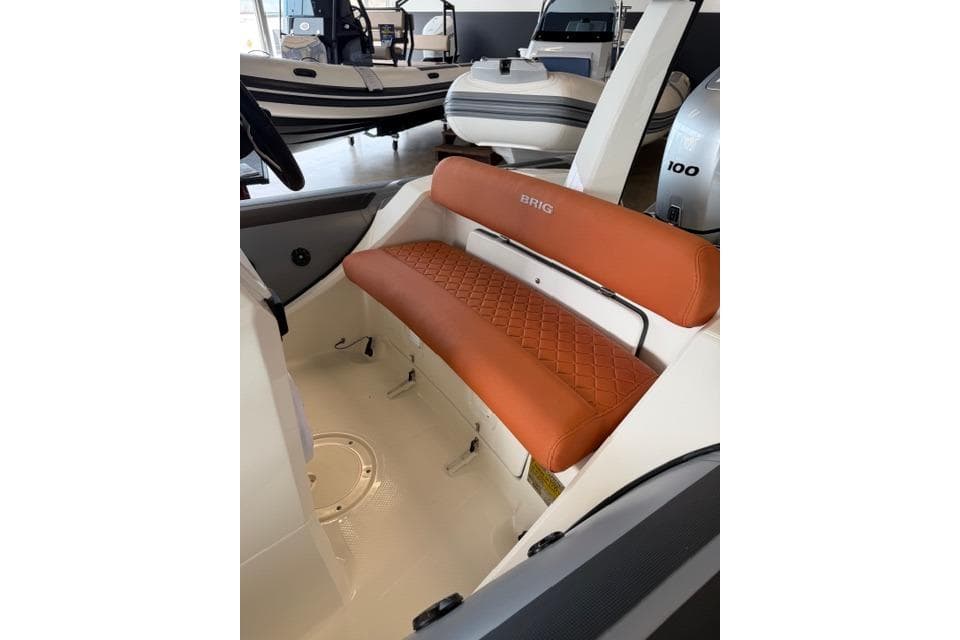2026 Brig Eagle 5 boat interior with orange quilted seating.