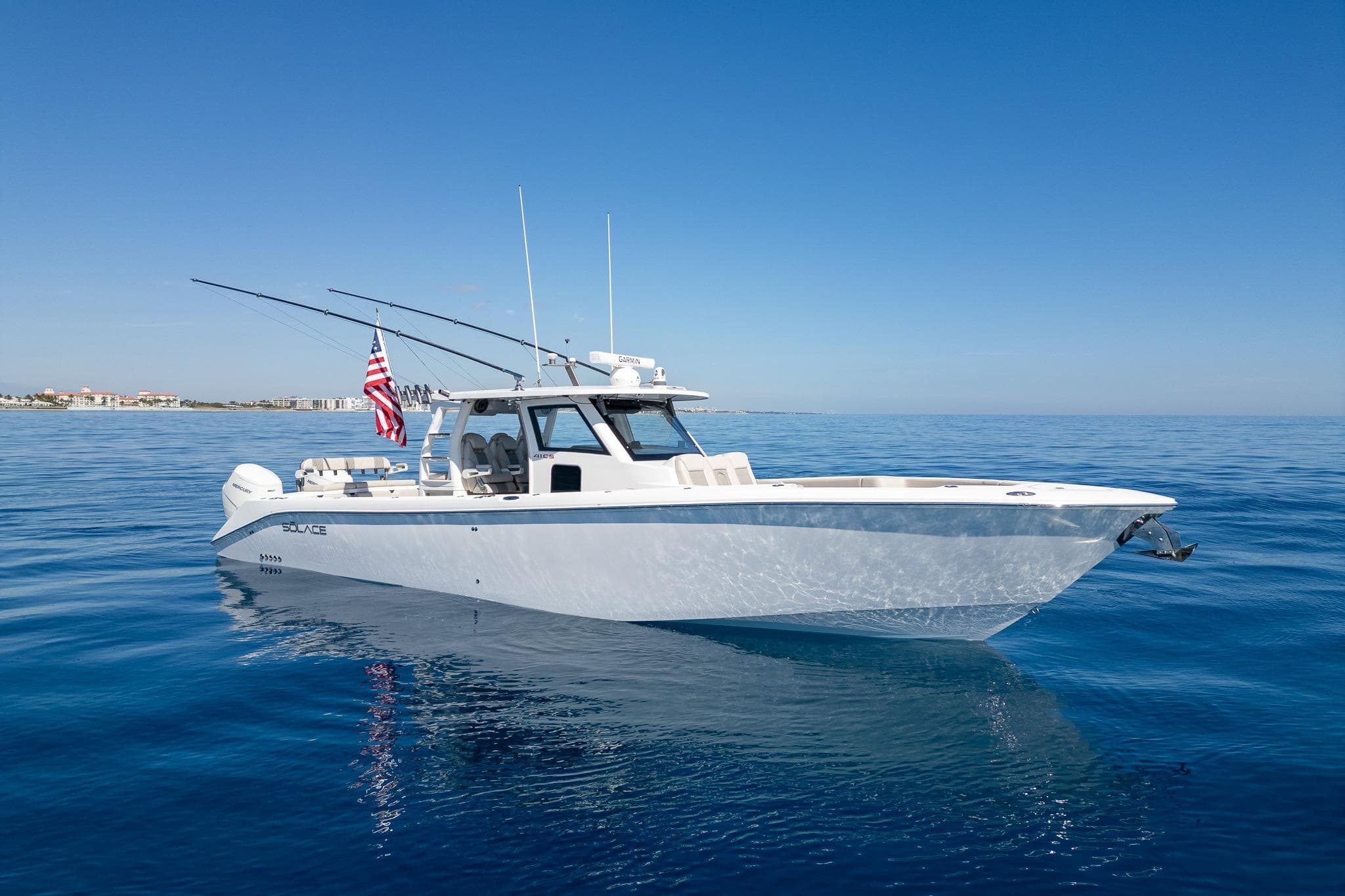 2024 Solace 41 CS boat on calm ocean with clear blue sky.