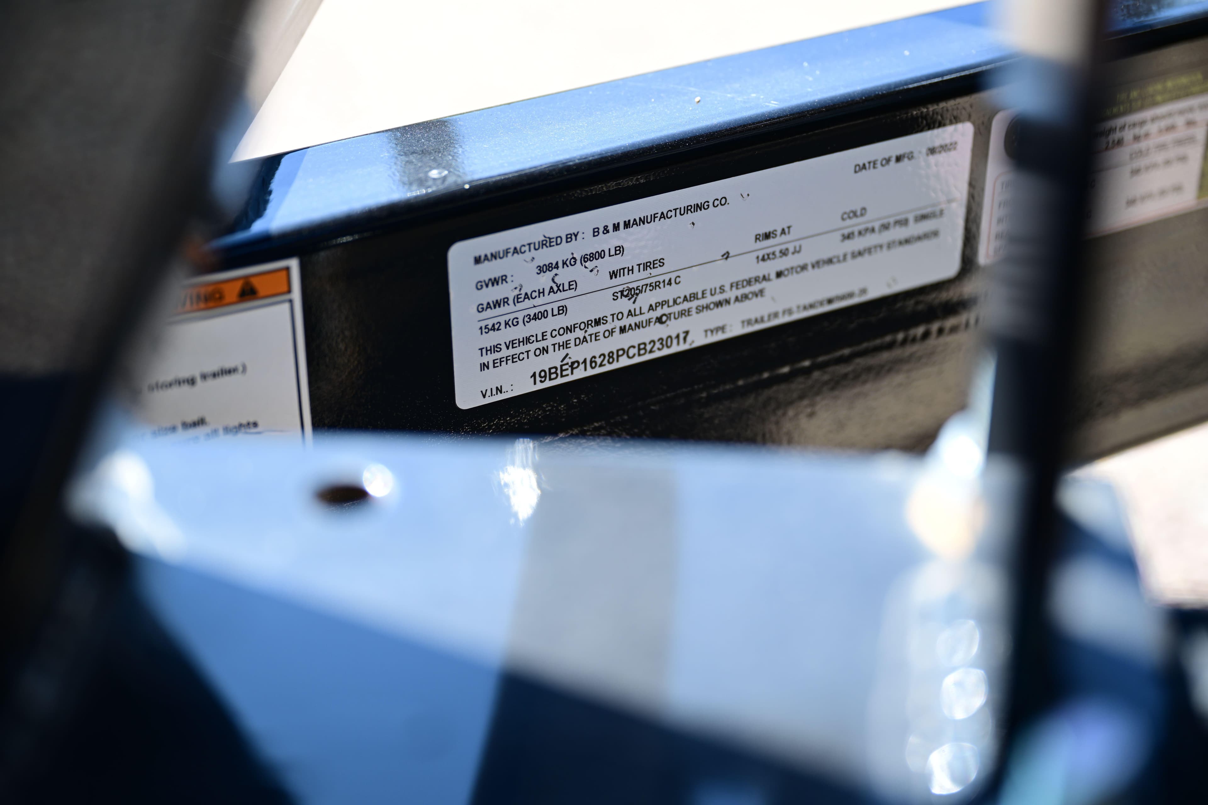 Close-up of a 2023 Aloha Pontoon Mahalo 23 vehicle identification label.