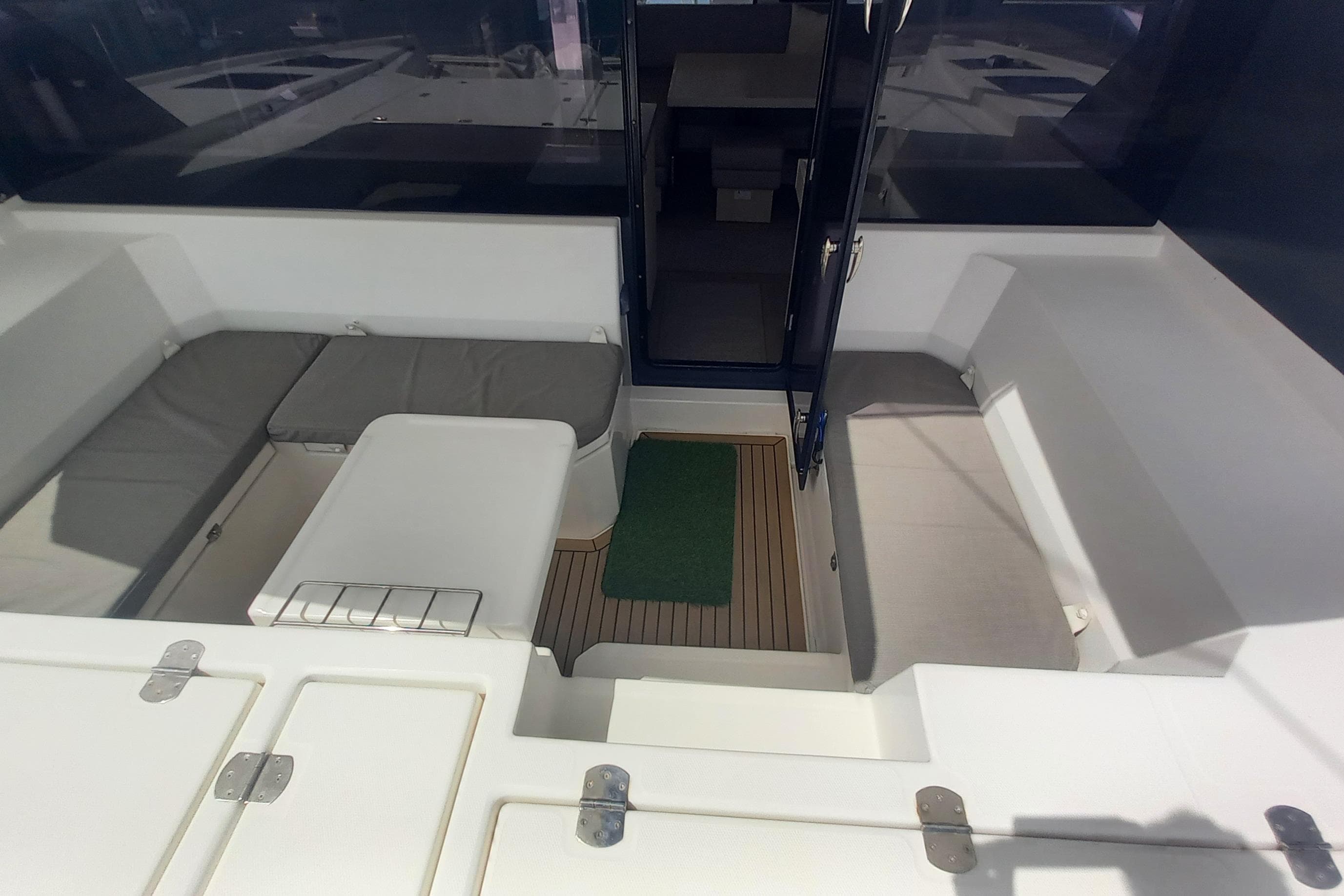 2019 Leopard 45 yacht interior with seating area and wooden flooring.