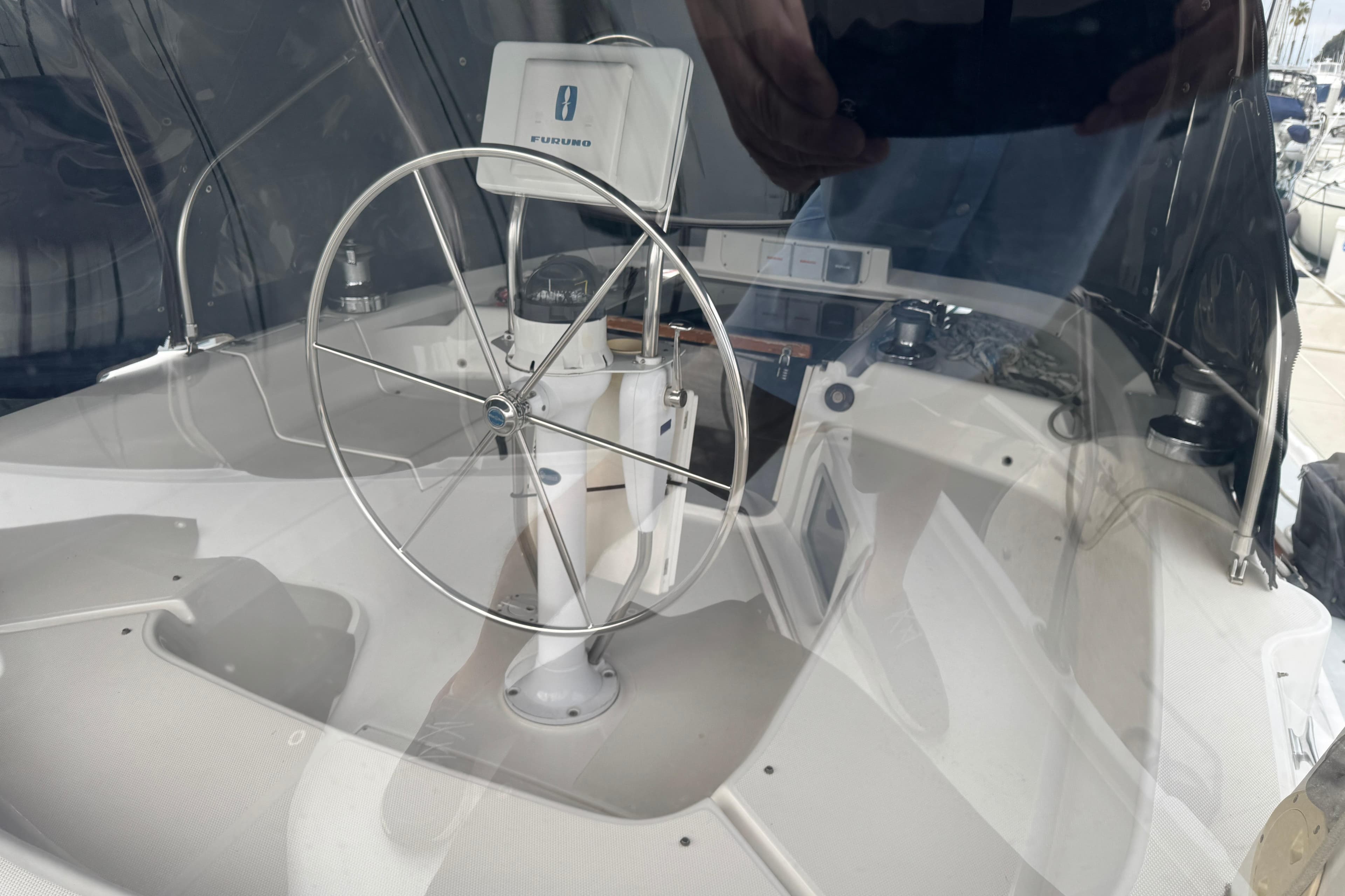 Steering wheel and navigation equipment on 1999 Hunter Passage 420 sailboat.