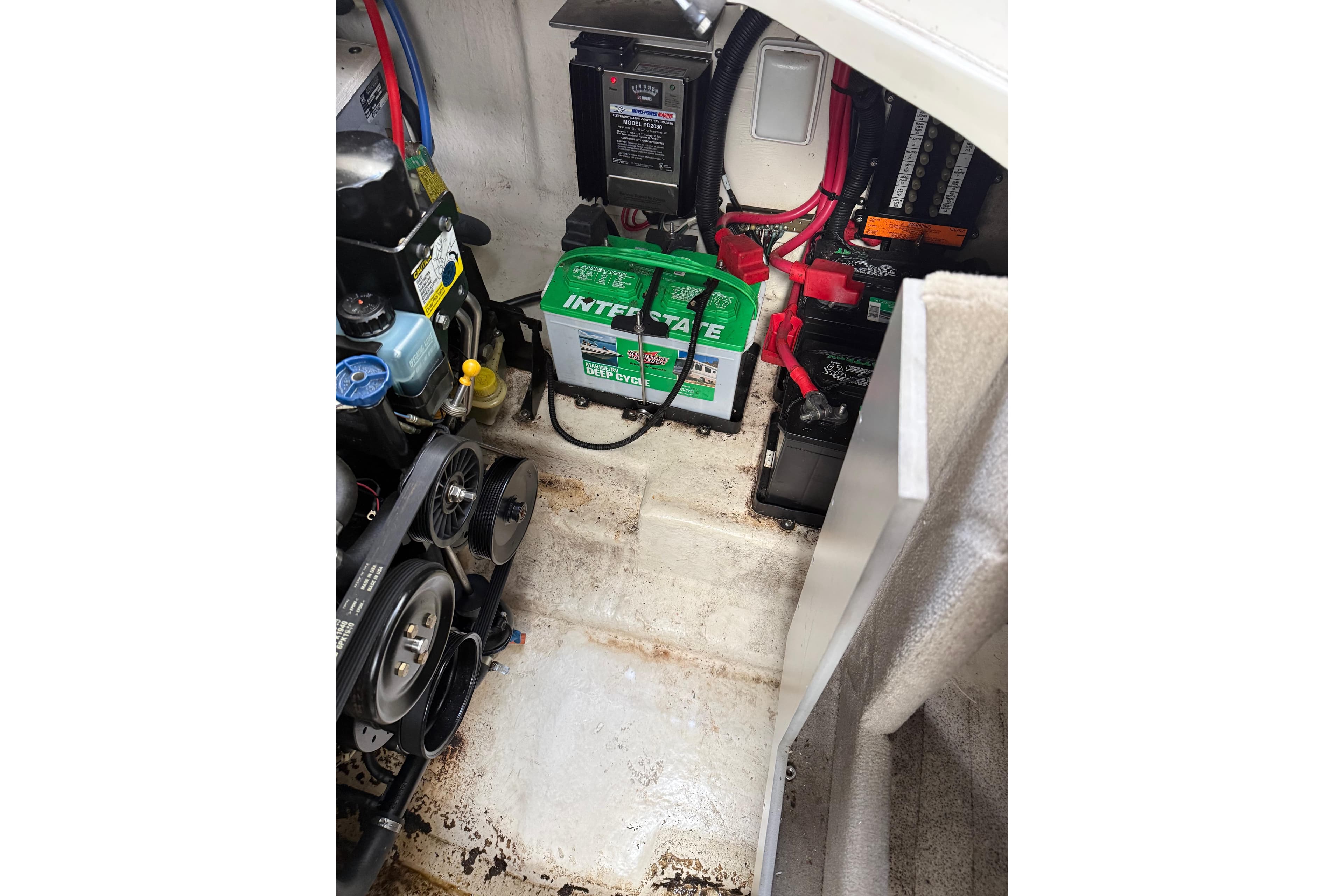 Engine compartment of 2007 Sea Ray 280 Cuddy Cabin with batteries and mechanical components.
