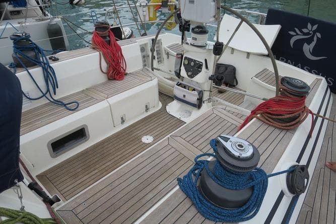 Cockpit of 2003 Nautor Swan 56 R yacht with ropes and steering wheel.
