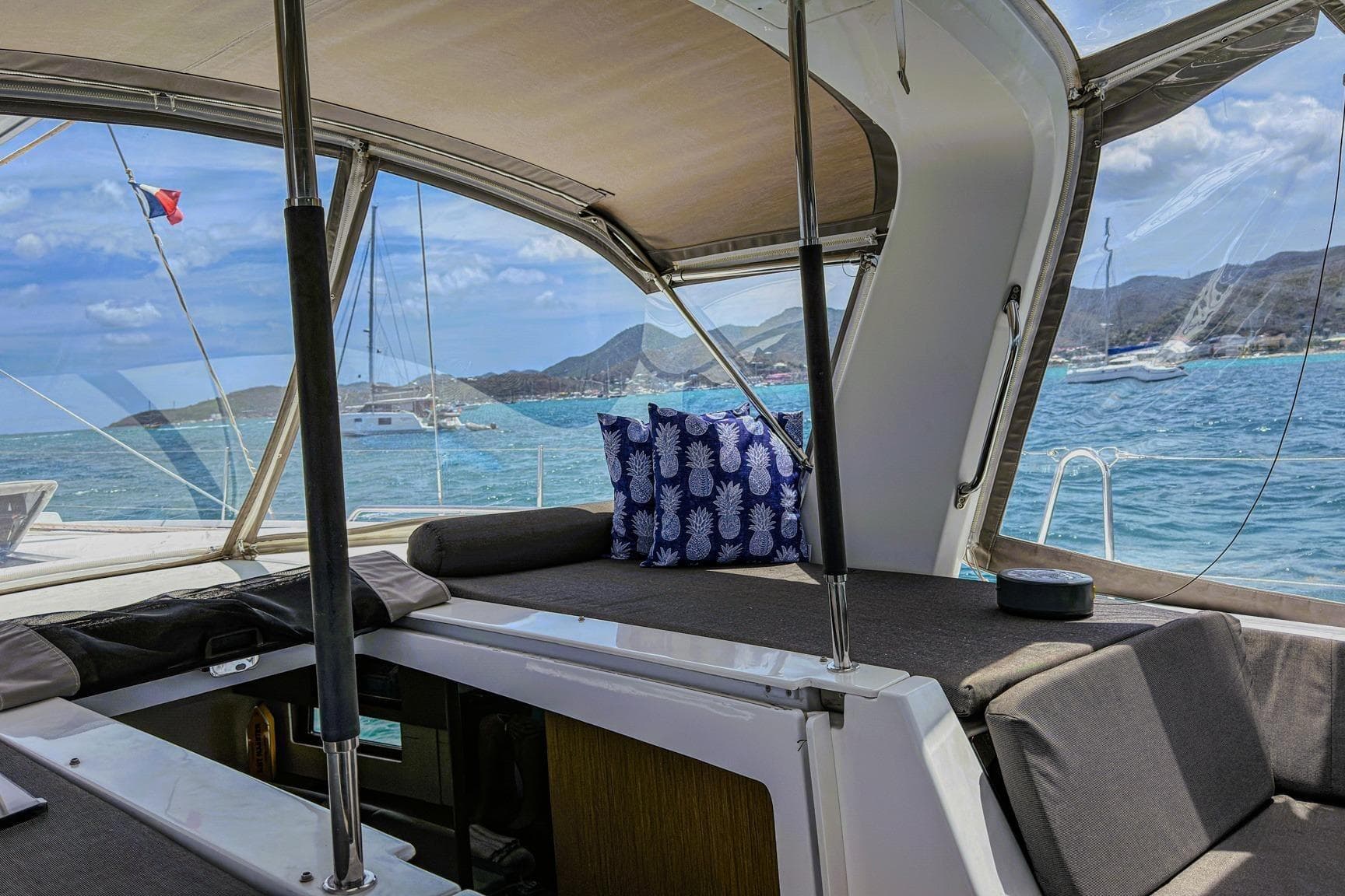 Interior view of 2020 Beneteau Oceanis 46.1 yacht with scenic ocean backdrop.