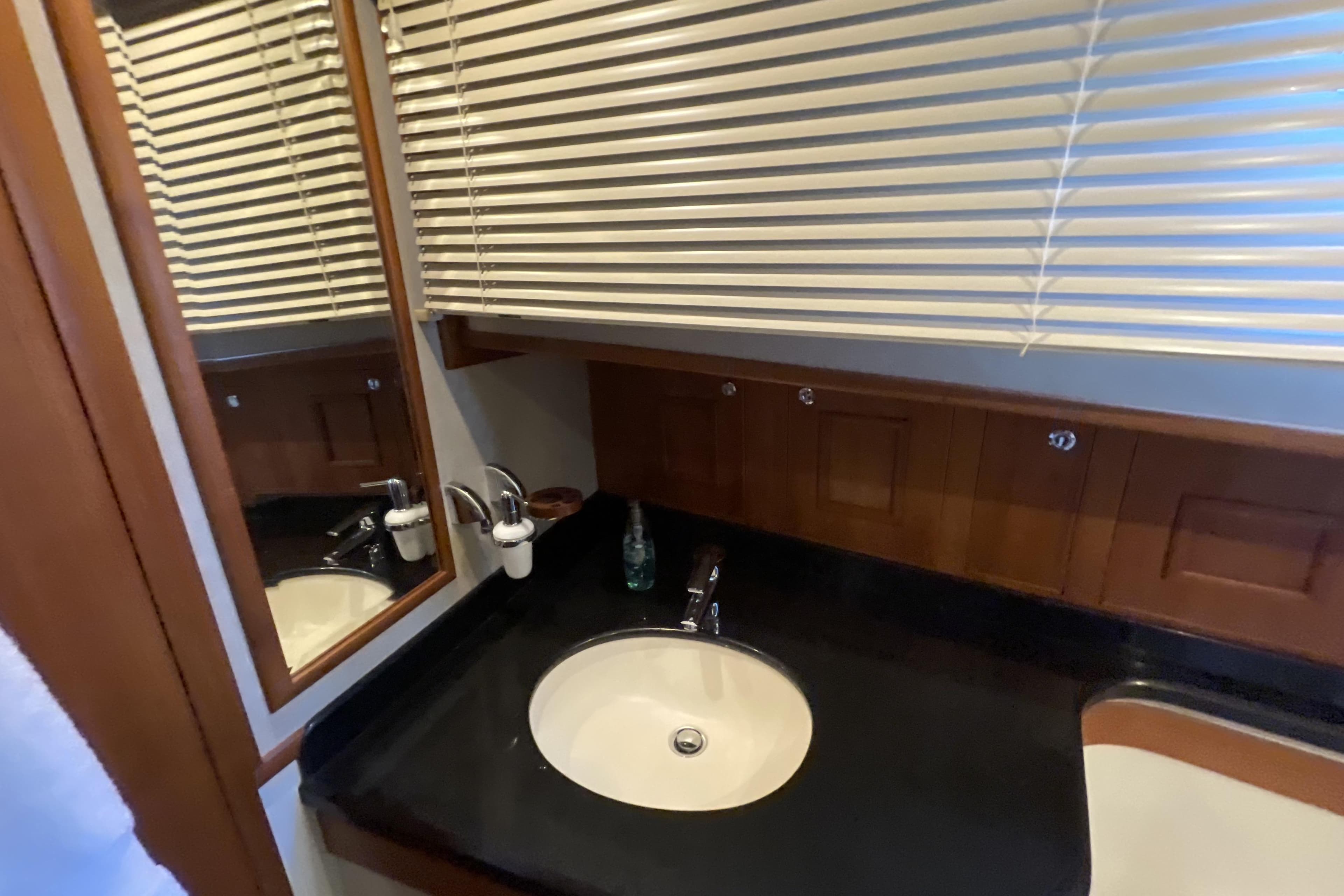 Luxurious bathroom sink area on 2007 Grand Banks 47 Heritage CL yacht.