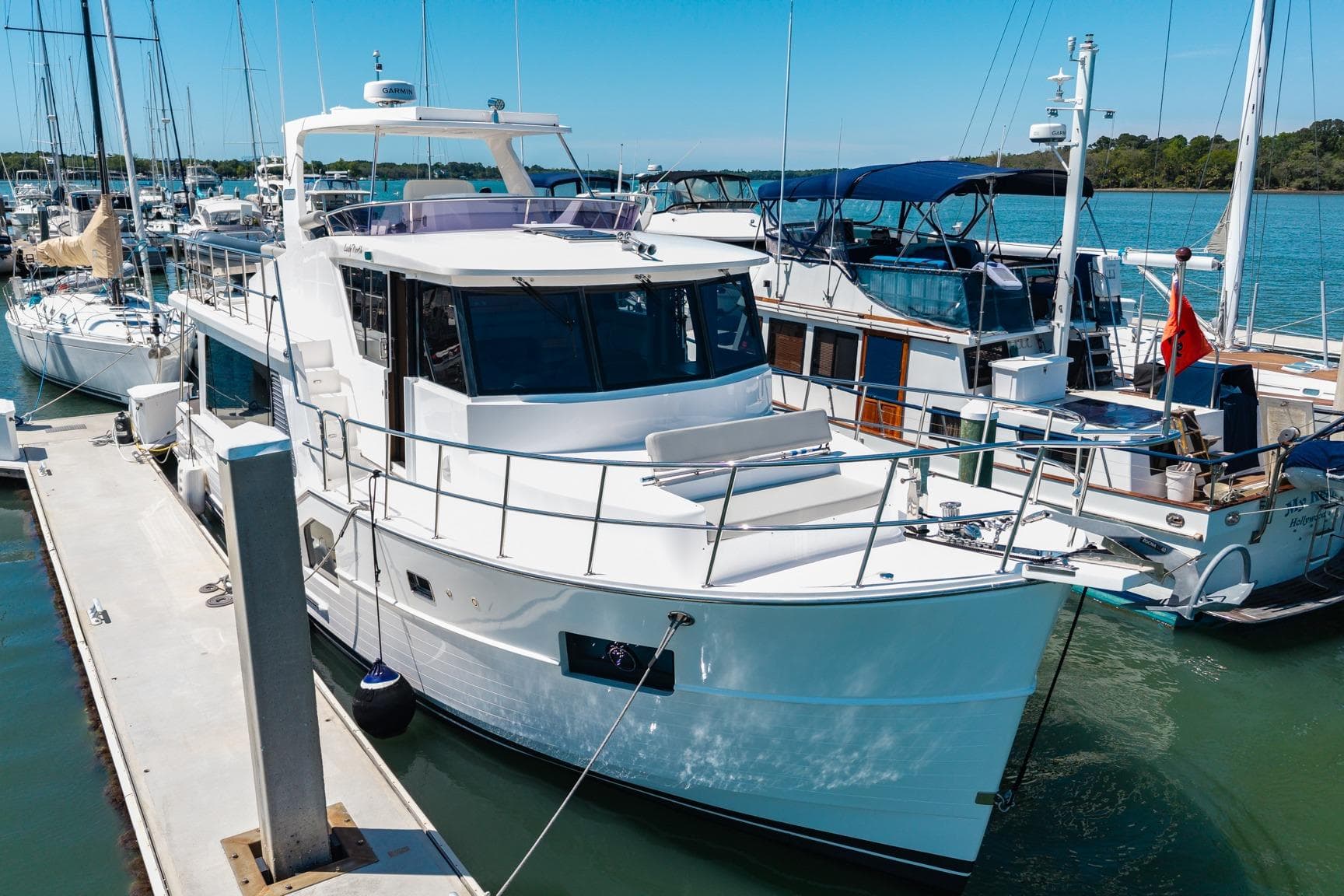 2023 North Pacific 49 Euro yacht docked at marina under clear blue sky.