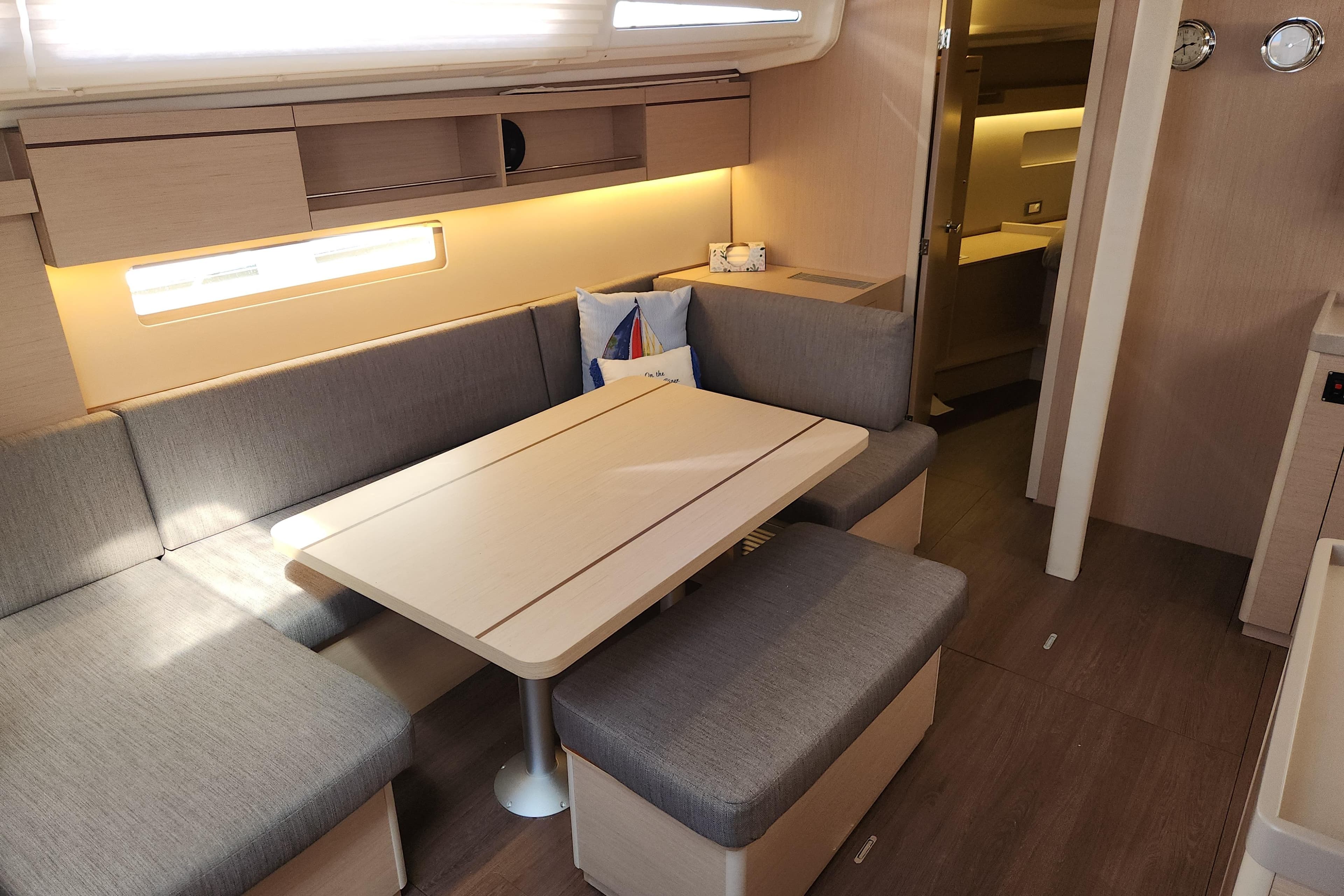Interior of 2022 Beneteau Oceanis 40.1 yacht with modern seating and dining area.