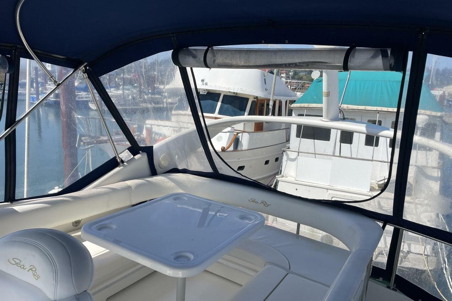 Interior view of a 2000 Sea Ray 400 Sedan Bridge yacht at a marina.