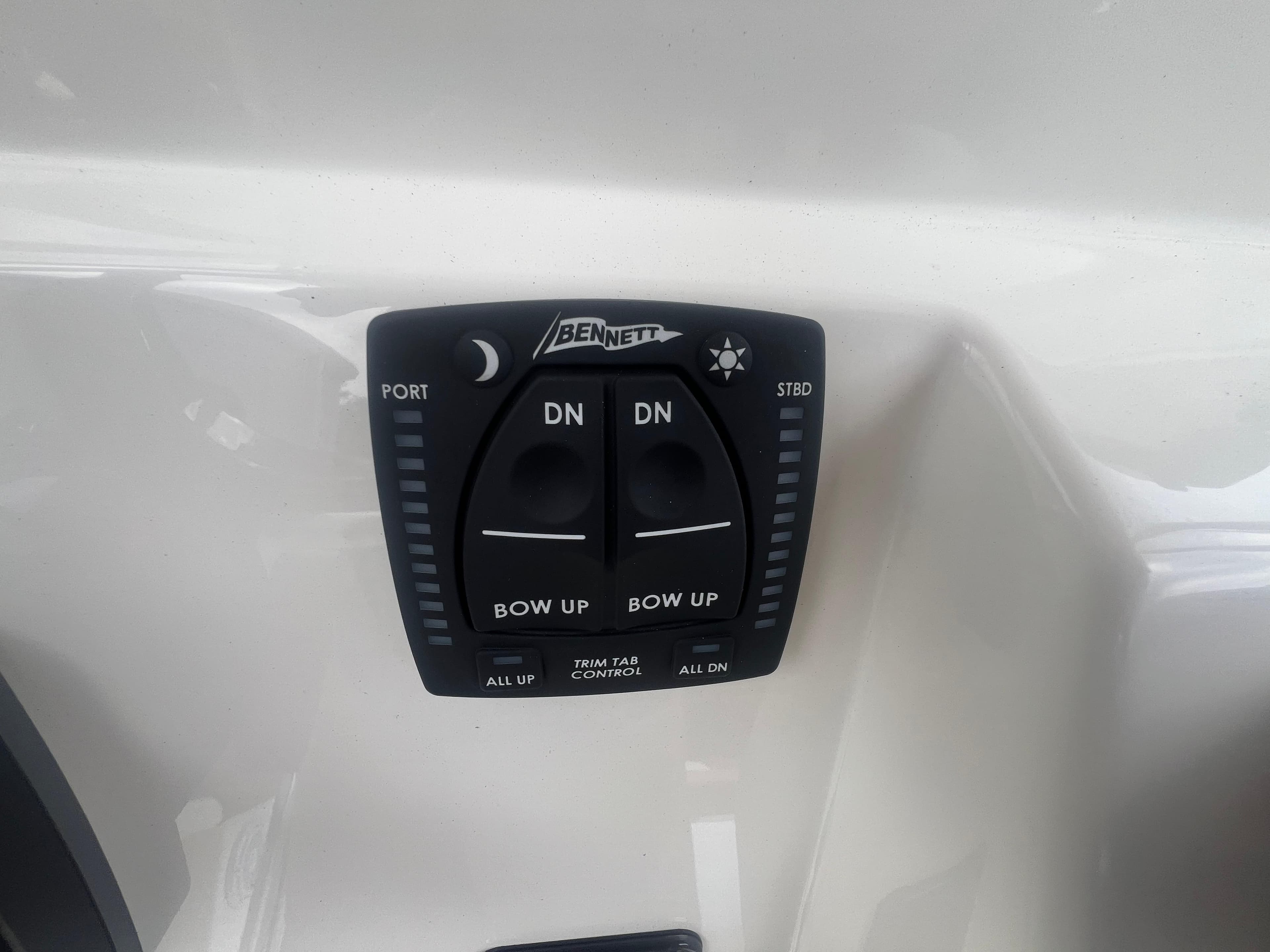 Bennett trim tab control on 2026 Pioneer 202 Islander boat dashboard.
