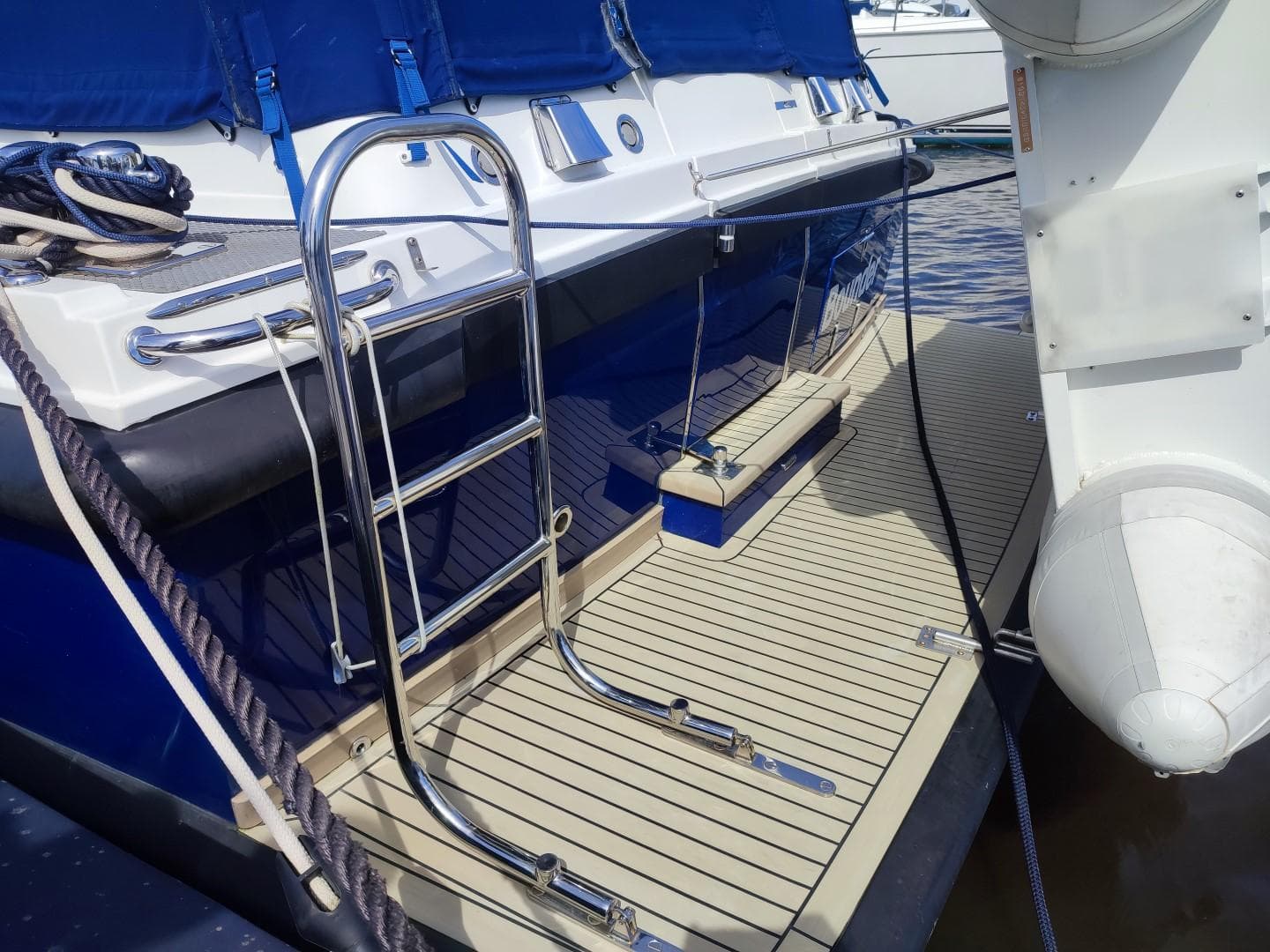 Stainless steel ladder on a 2016 Seaward MY-42 yacht with blue accents.