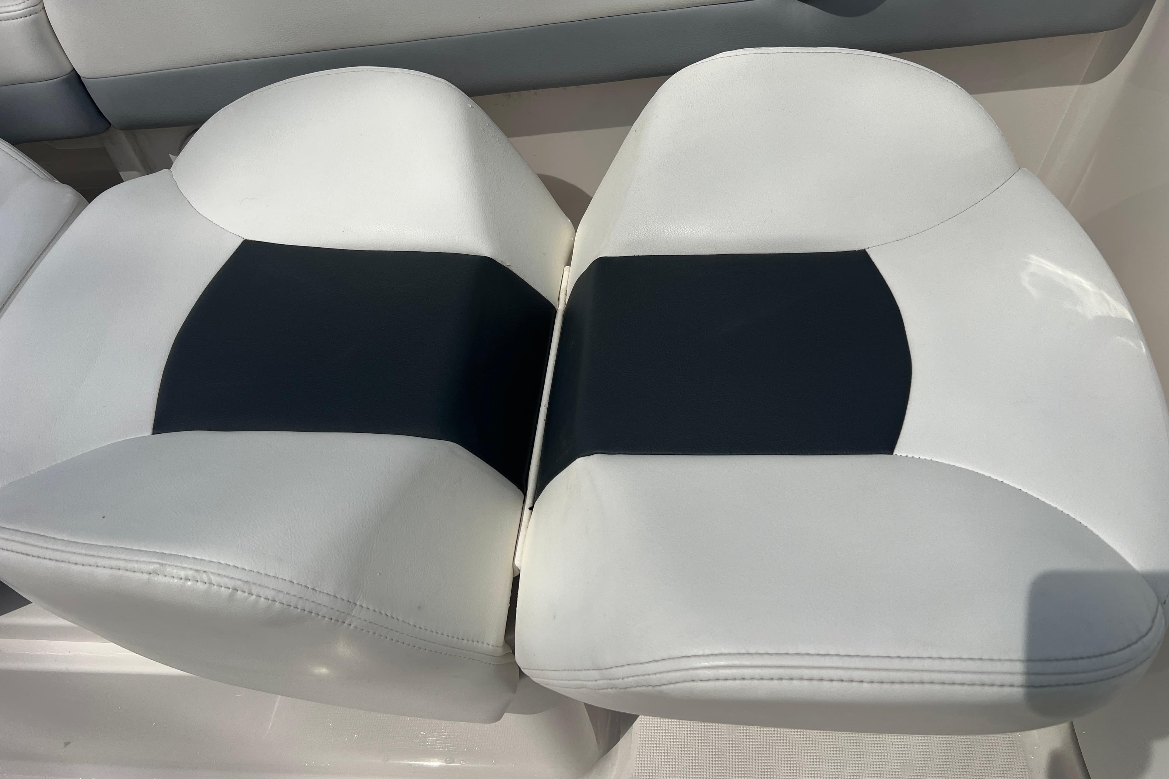 White and black seating on 2022 Robalo R227 Dual Console boat.