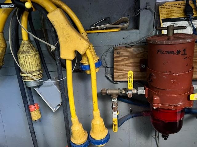 Electrical and plumbing components on a 1962 Matthews 42 Double Cabin boat.