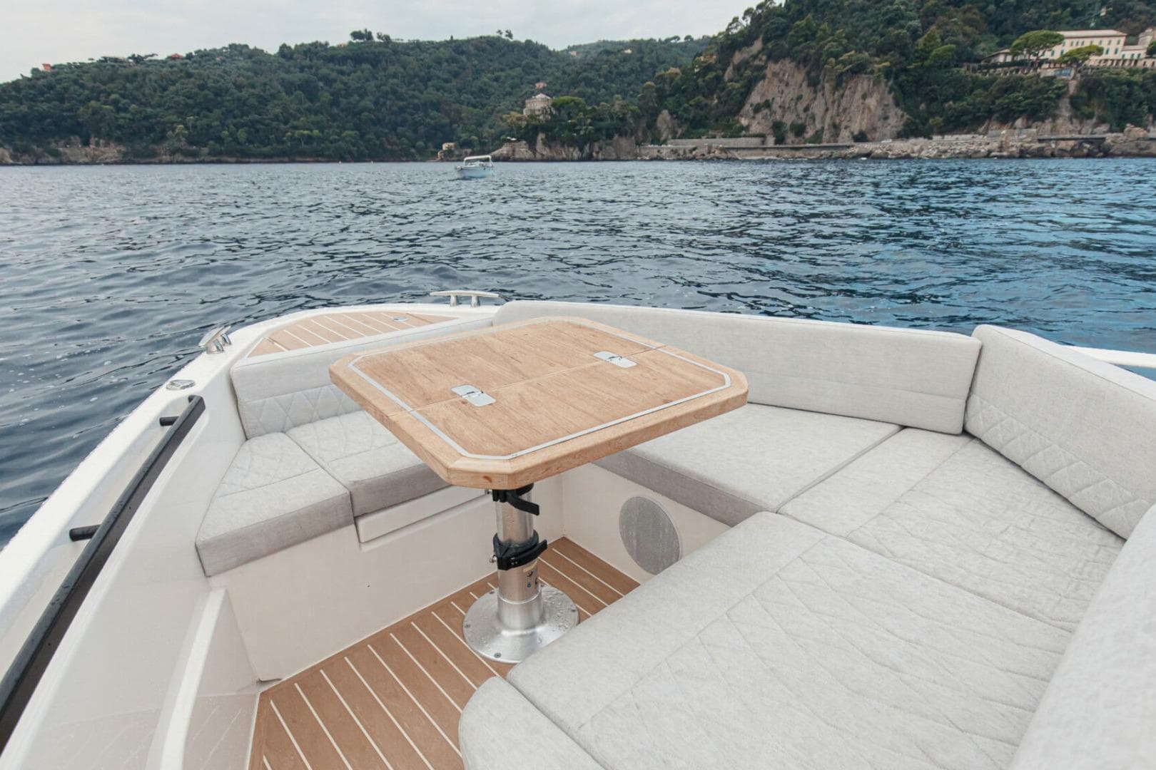 Luxurious Saxdor 400 GTC boat interior with seating and table, 2026 model, scenic ocean view.