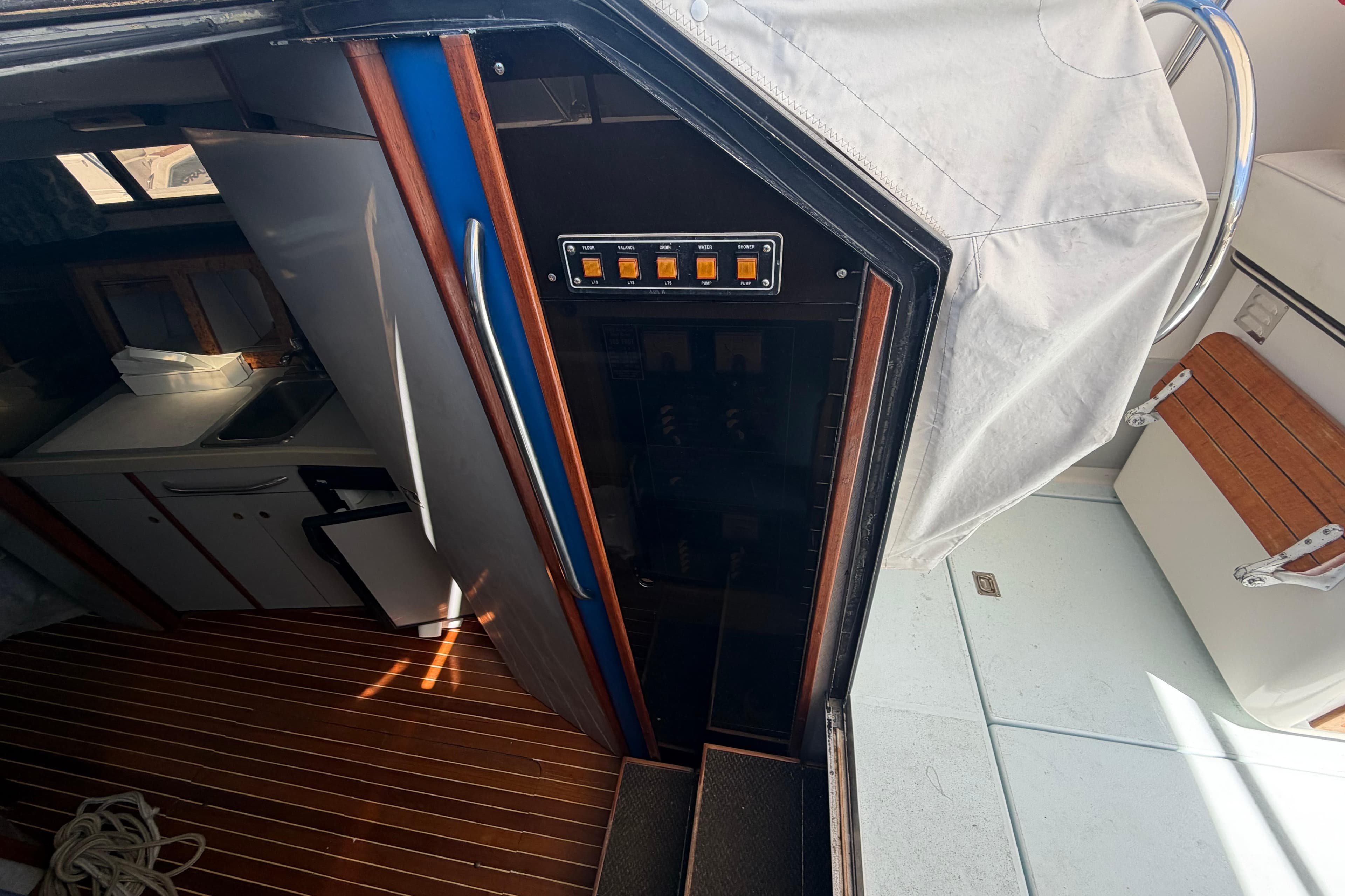 Interior view of a 1985 Formula 31 Performance Cruiser, featuring a compact kitchen area.