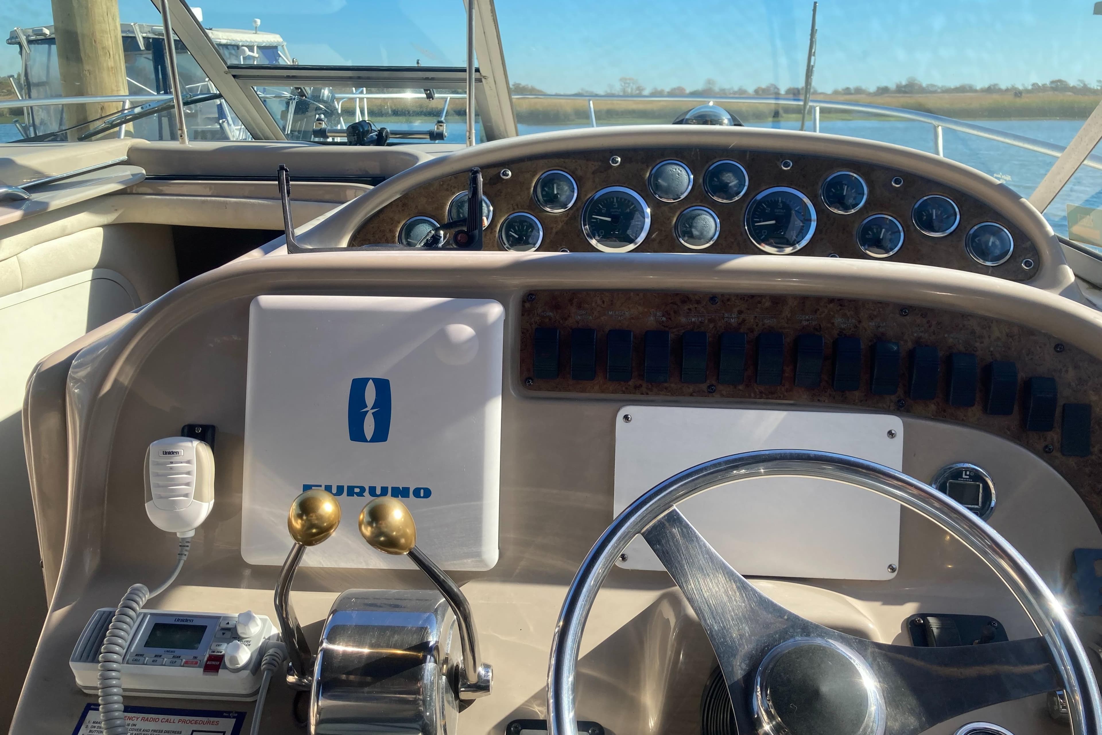 Control panel of a 2000 Sea Ray 290 Amberjack boat with Furuno equipment.