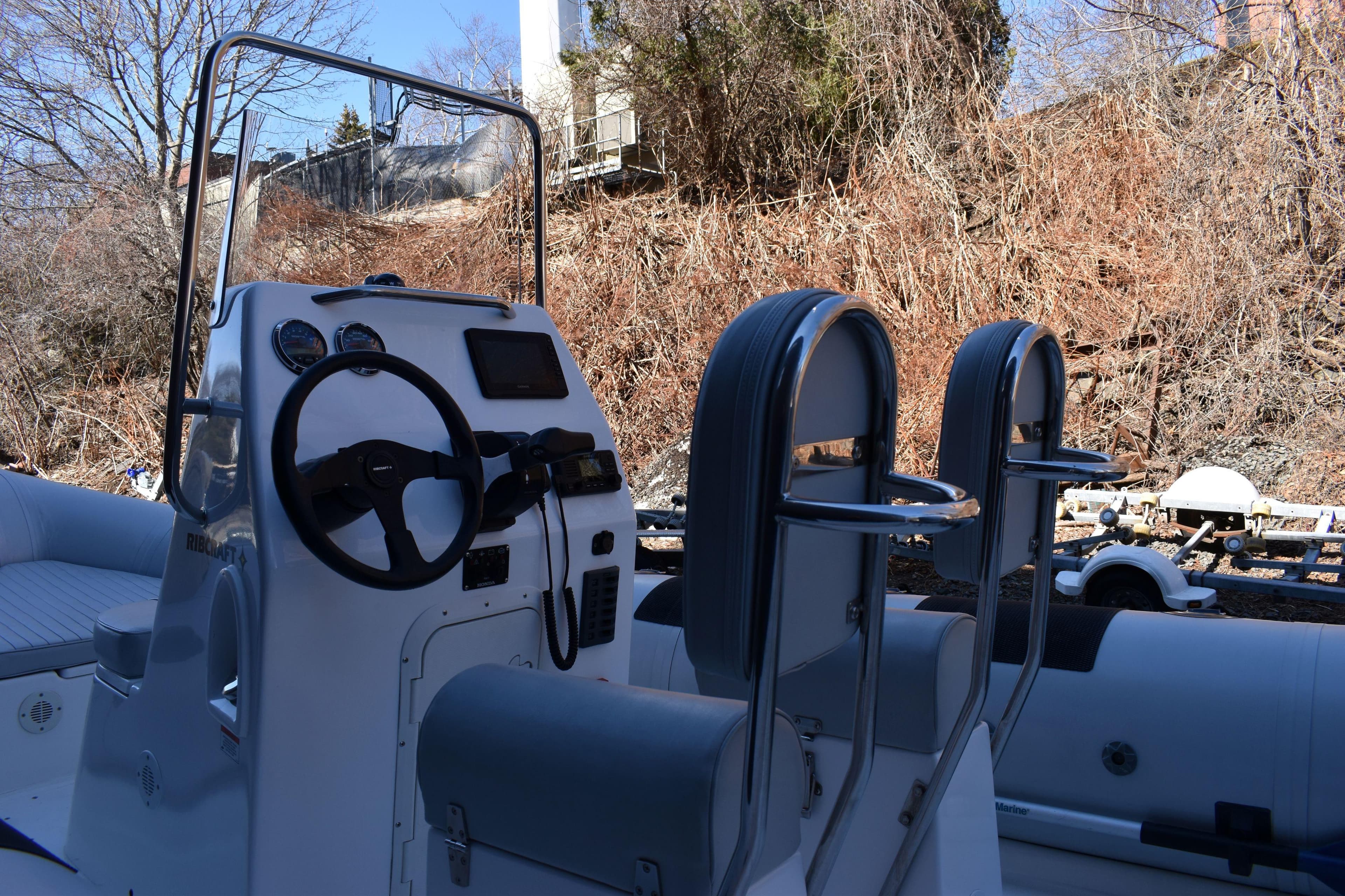 2020 Ribcraft 5.85 boat interior with steering console and seating.