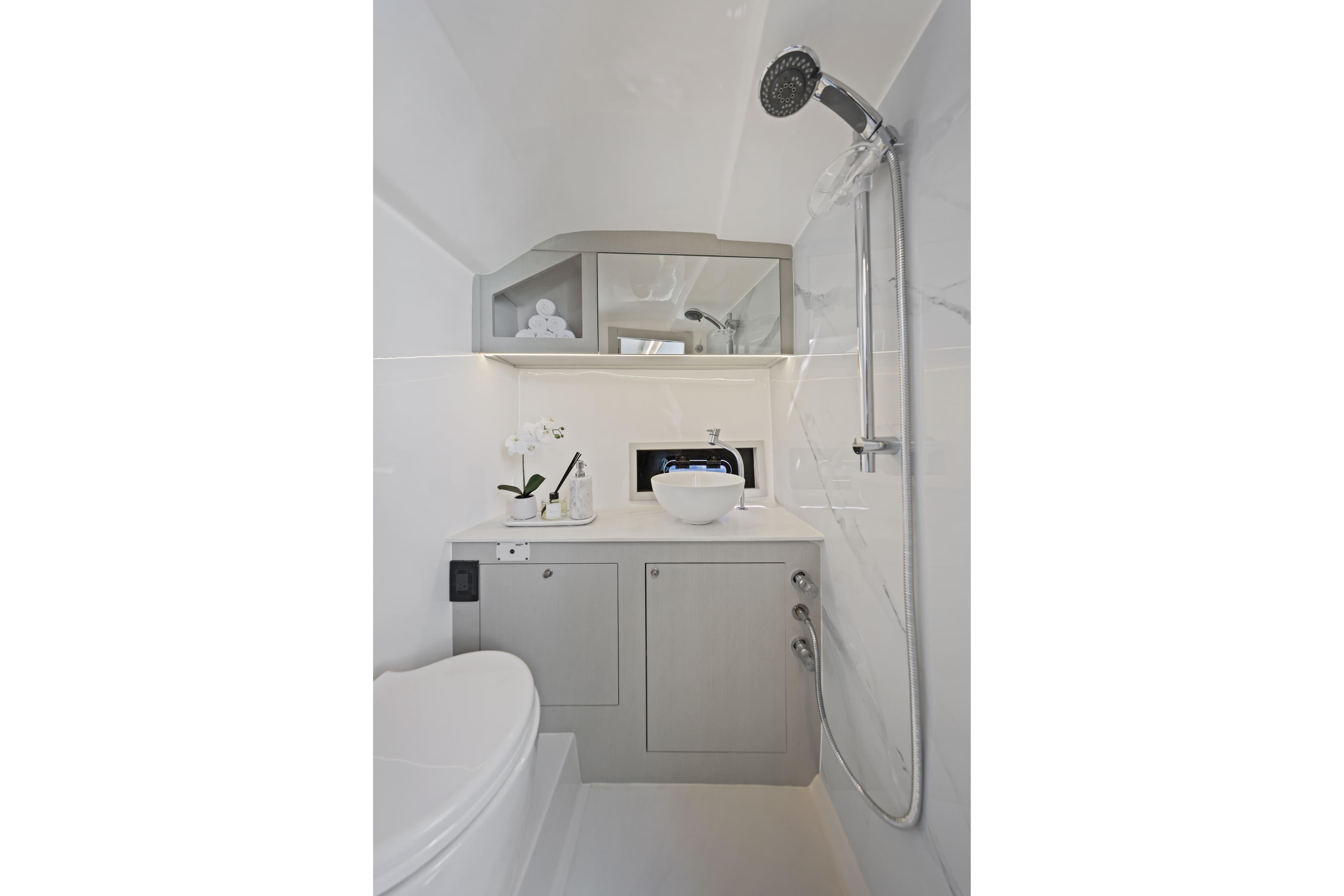 Modern bathroom in 2026 Valiatt 380 Bowrider boat, featuring sleek fixtures and elegant design.