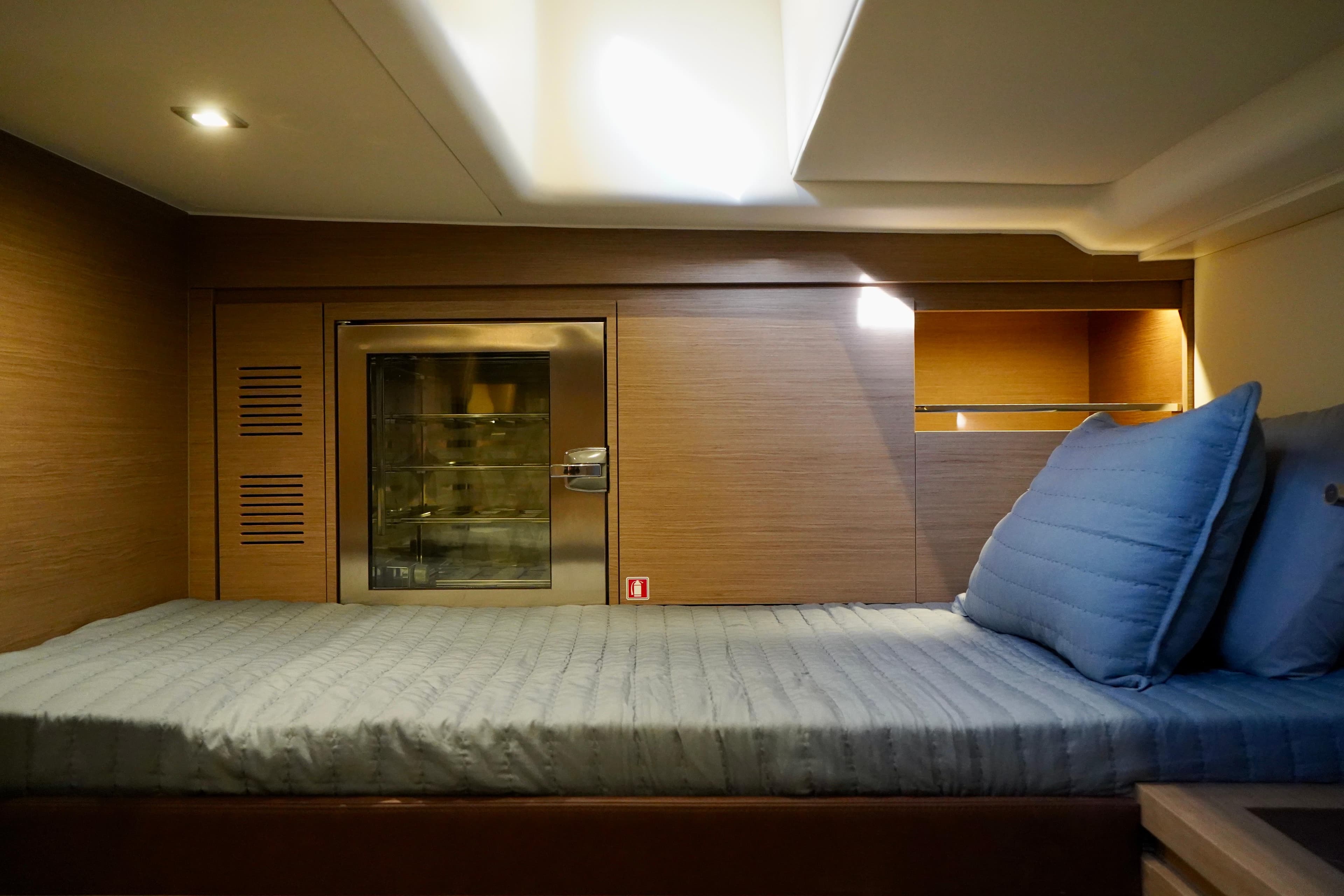 Luxurious cabin interior of 2025 Pardo Yachts 43 with cozy bedding and modern design.