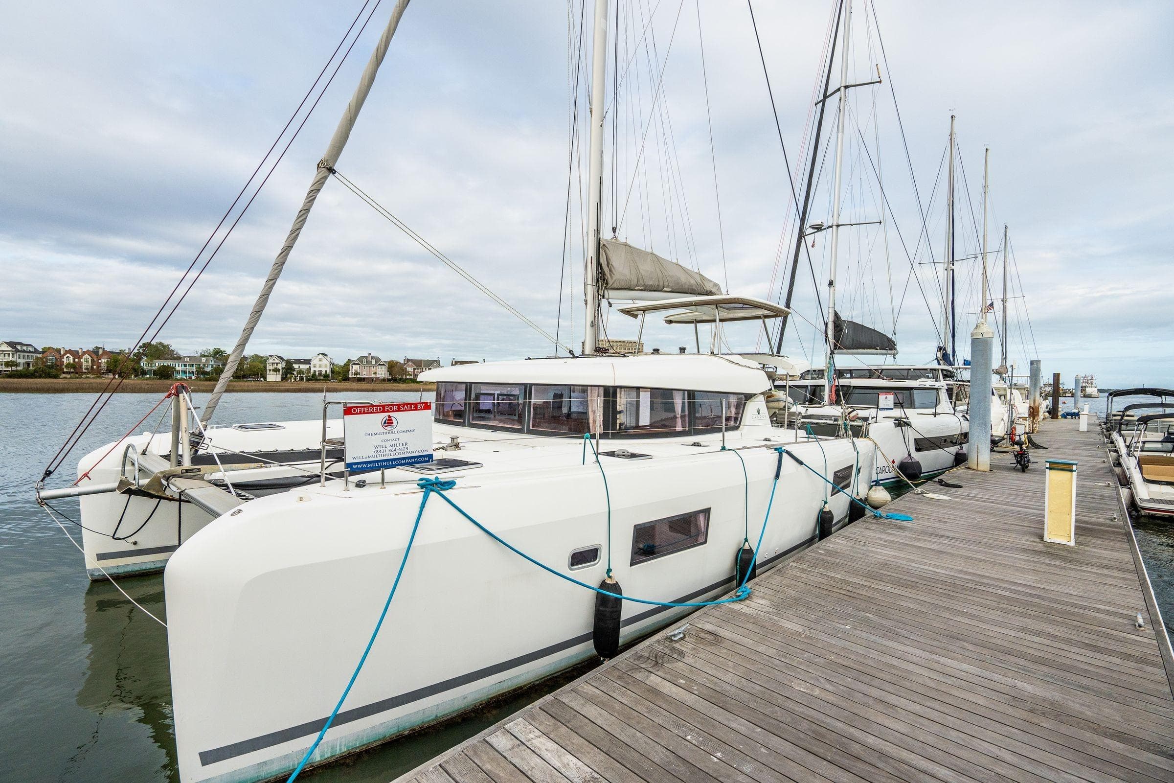 2017 Lagoon 42 catamaran docked, available for sale, with sails and ropes visible.