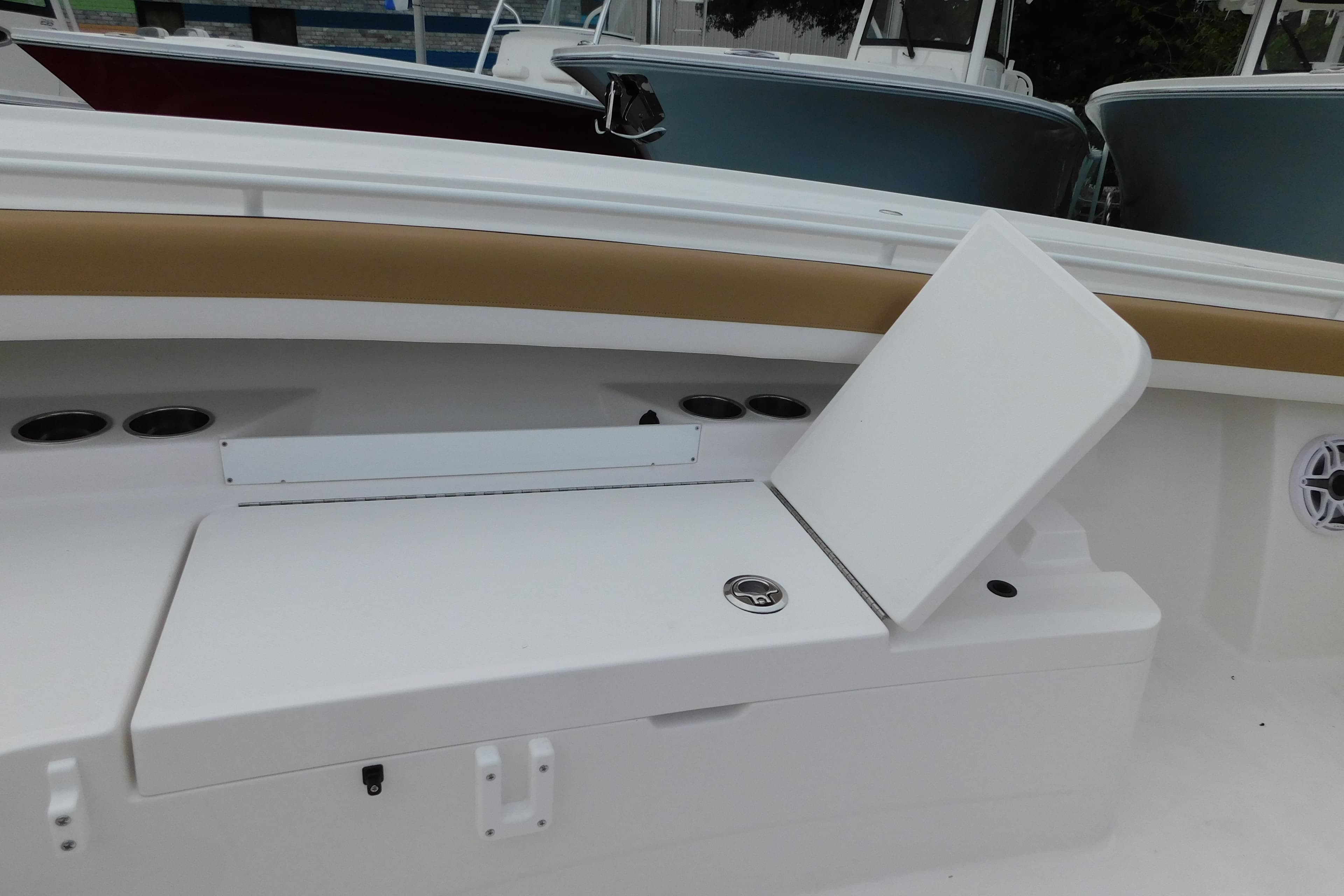 2026 Regulator 28 boat interior with open storage compartment and cup holders.