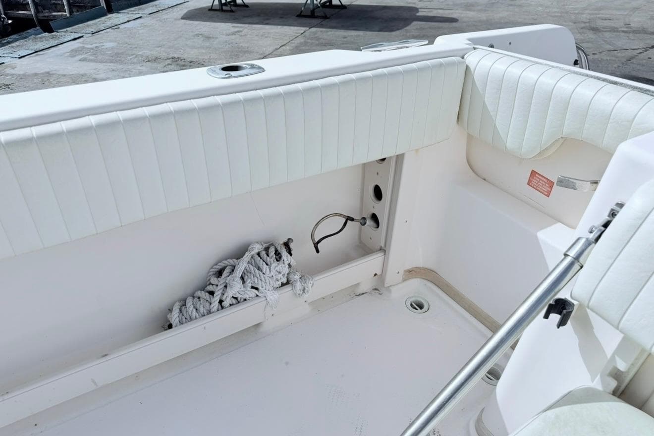 2005 Grady-White Journey 258 boat interior with white seating and coiled rope.