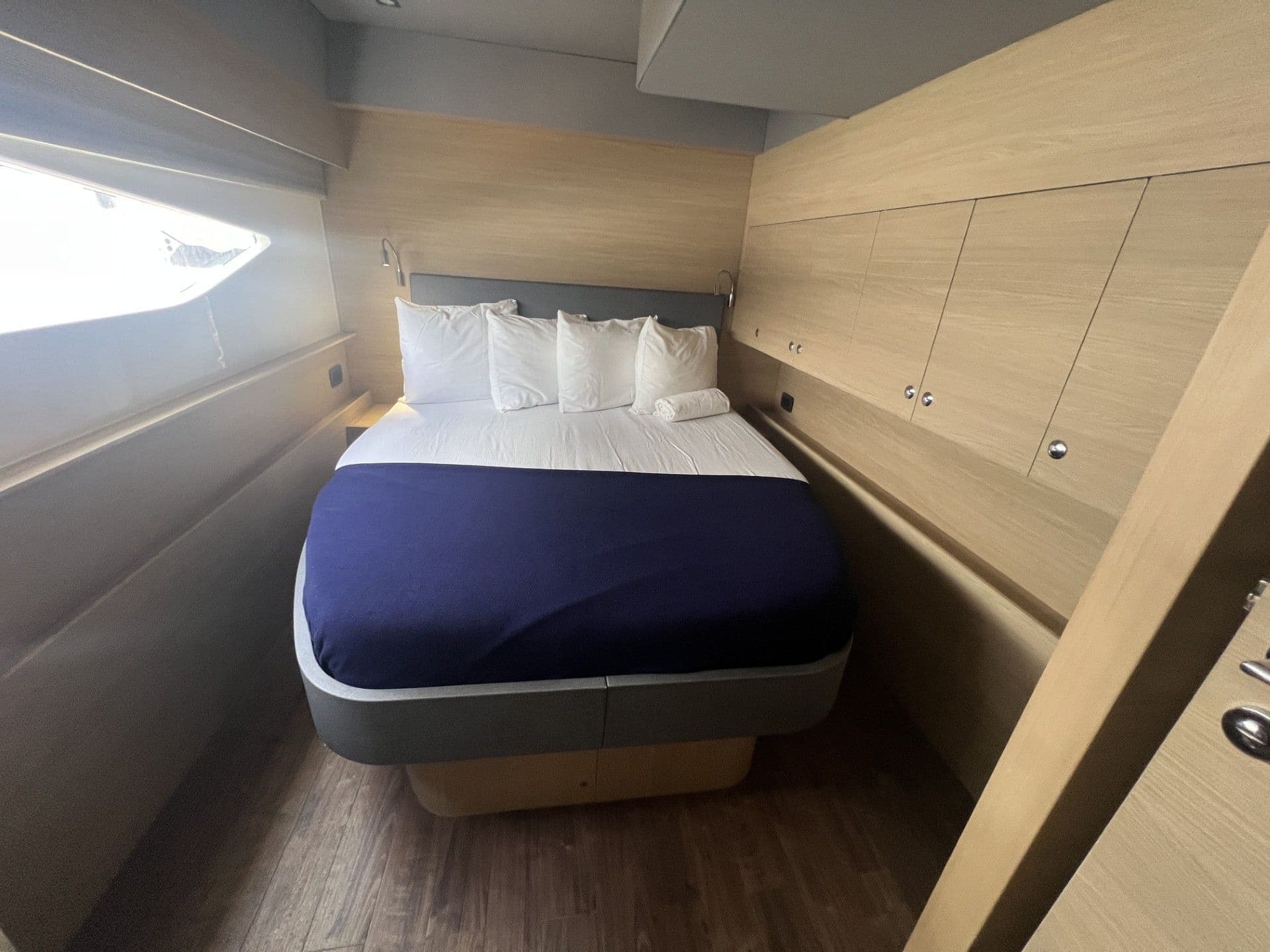 Interior of 2023 Aquila 54 Yacht featuring cozy bedroom.