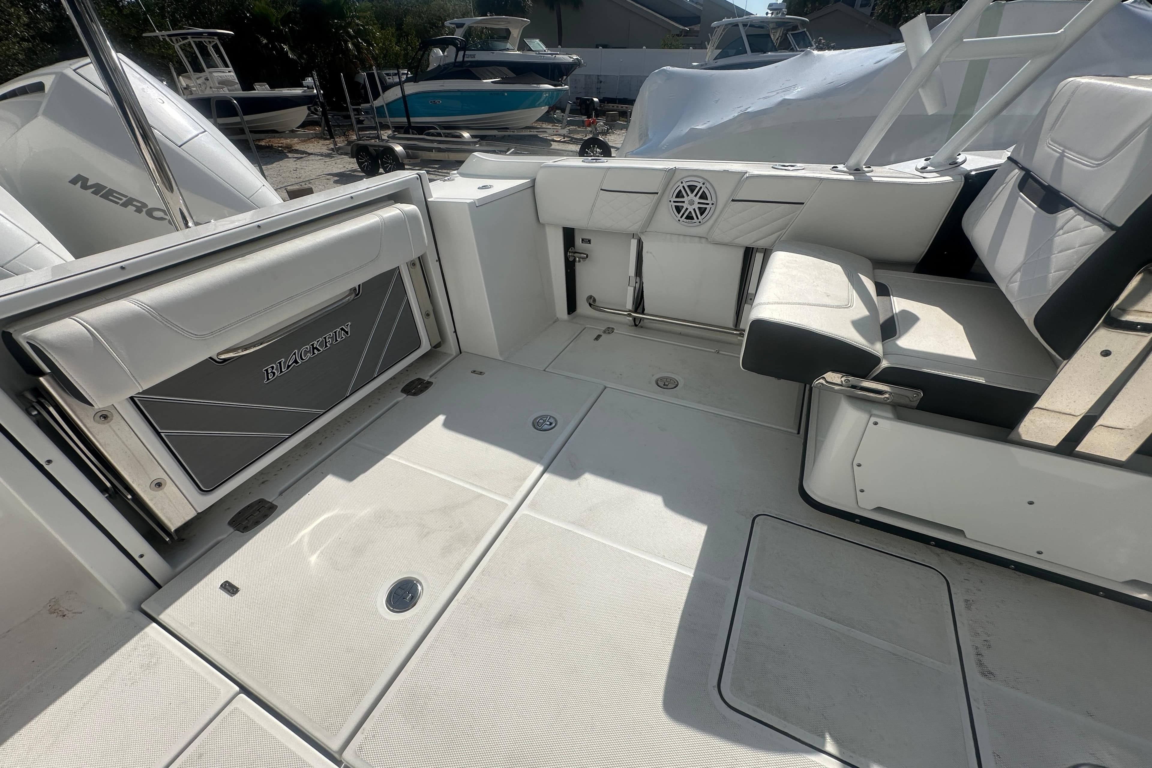 2021 Blackfin 252 DC boat interior with seating and storage compartments.