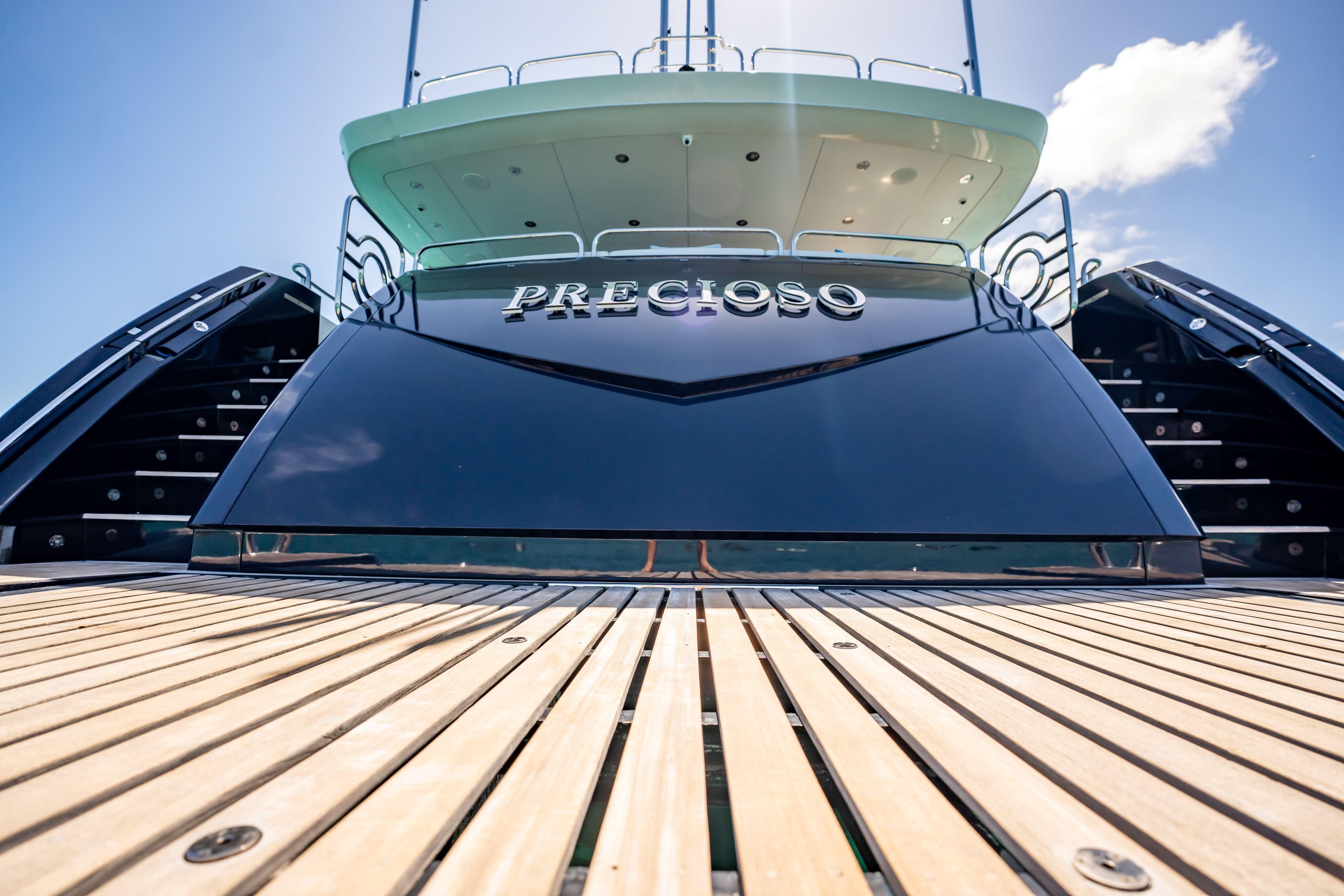 Sunseeker 34 Metre Yacht 2011, rear view with wooden deck and stairs.