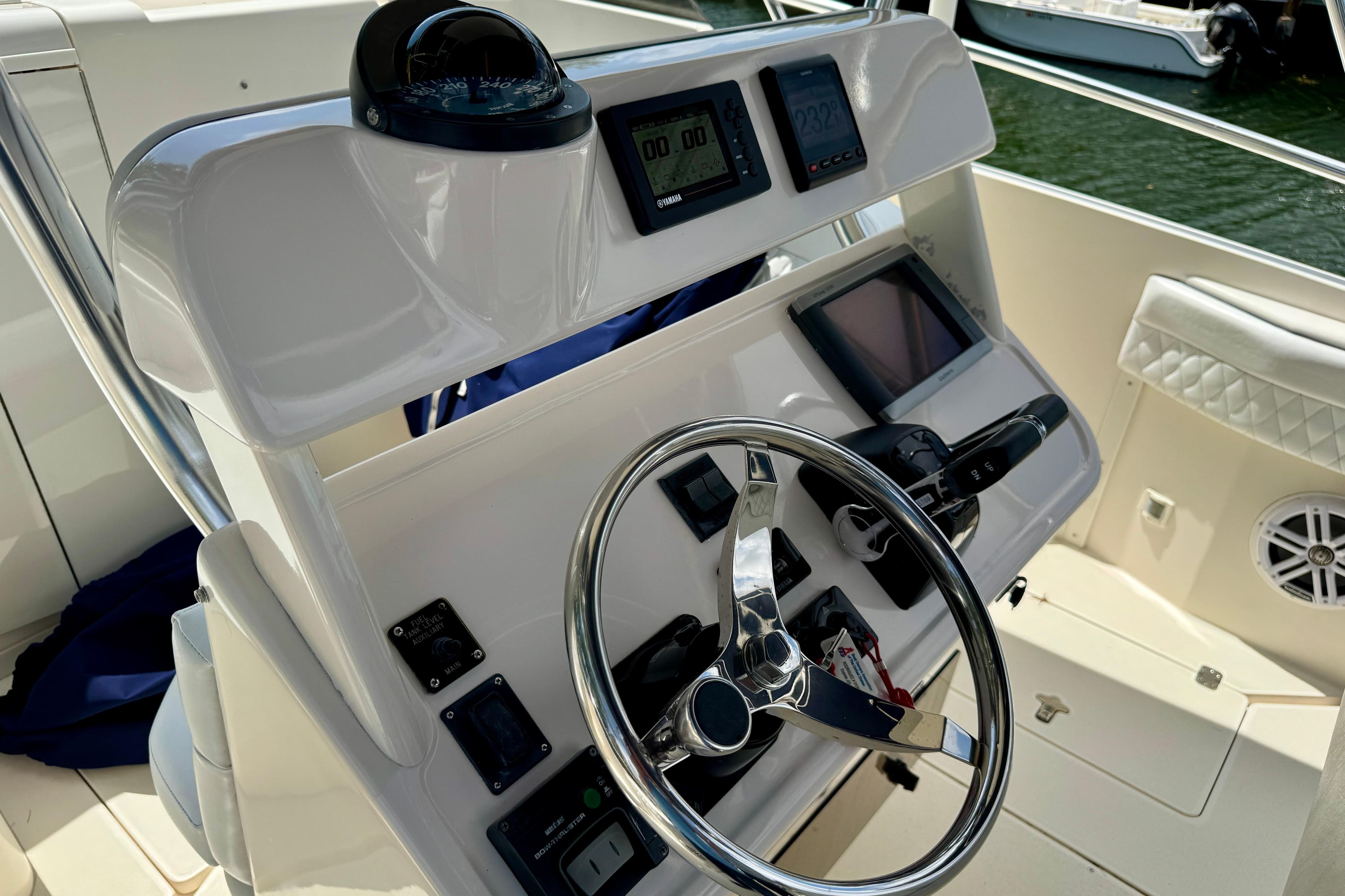 Helm of 2001 Intrepid 339 Walkaround with steering wheel and navigation instruments.