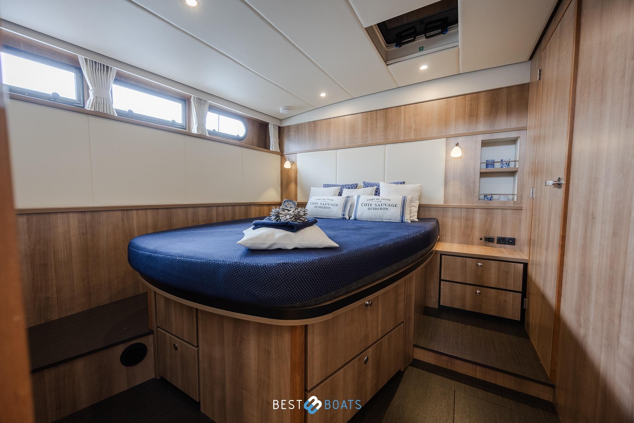 Luxurious cabin interior of 2022 Linssen 40 SL AC yacht with elegant wood finish.