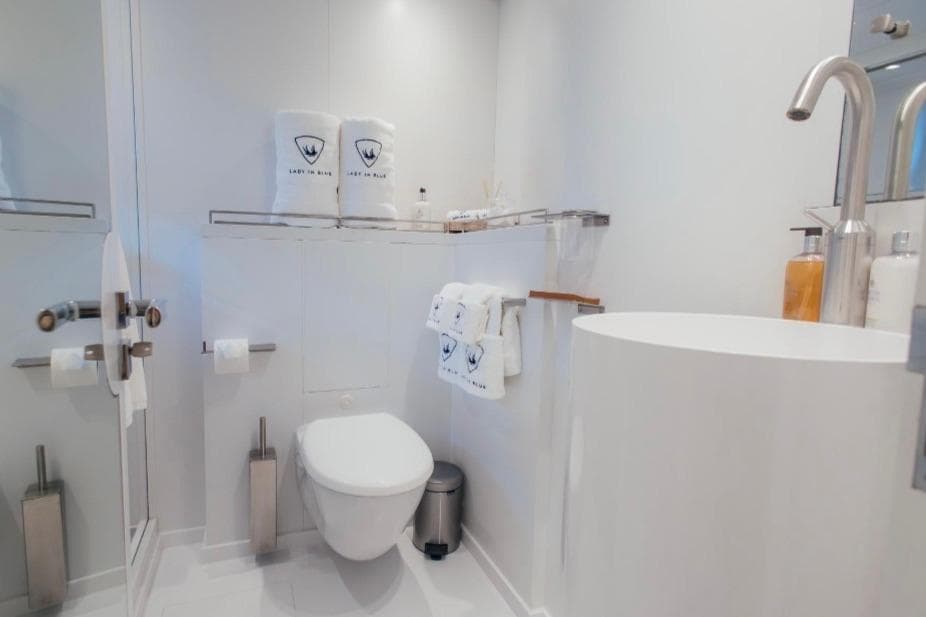 Luxurious bathroom on Clemna Rossi Navi 135 yacht, featuring modern fixtures and elegant design.