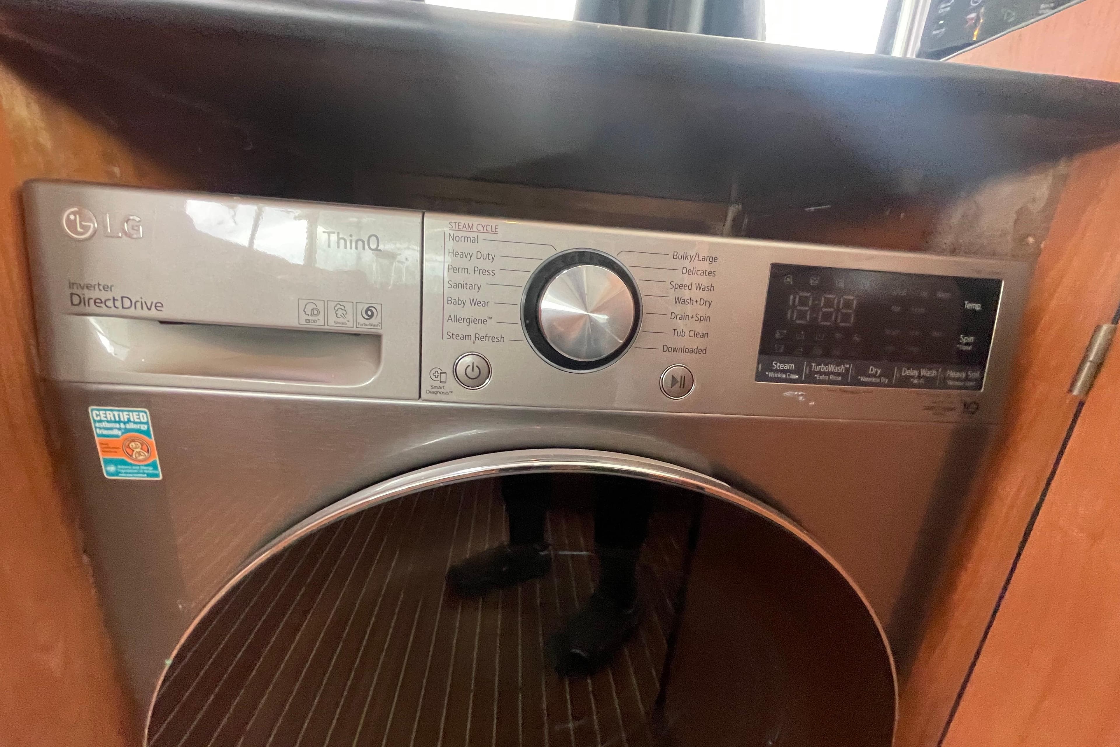 LG ThinQ Direct Drive washing machine with digital display and control panel.