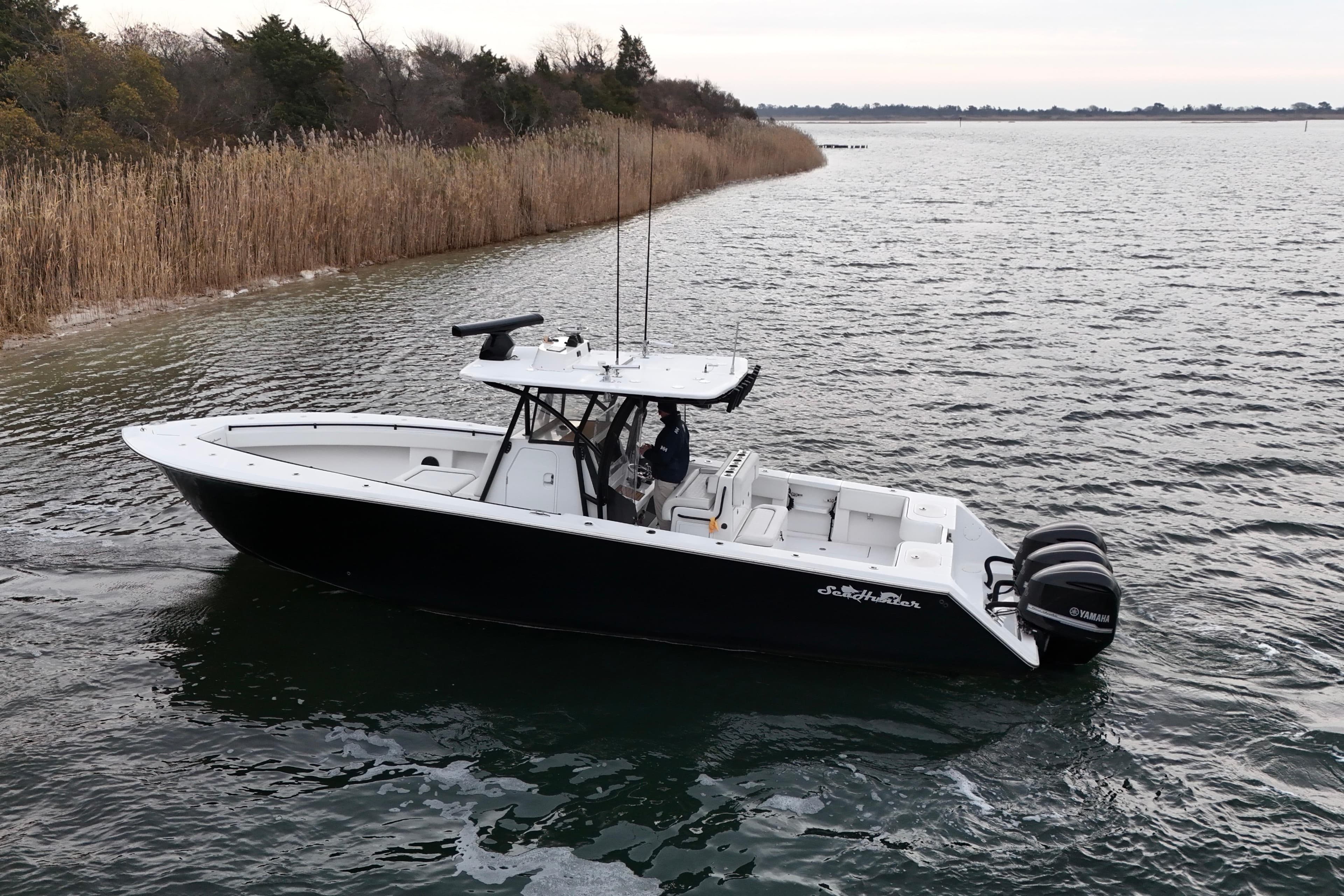 2016 Sea Hunter 35 Tournament boat on calm water, featuring dual Yamaha engines.