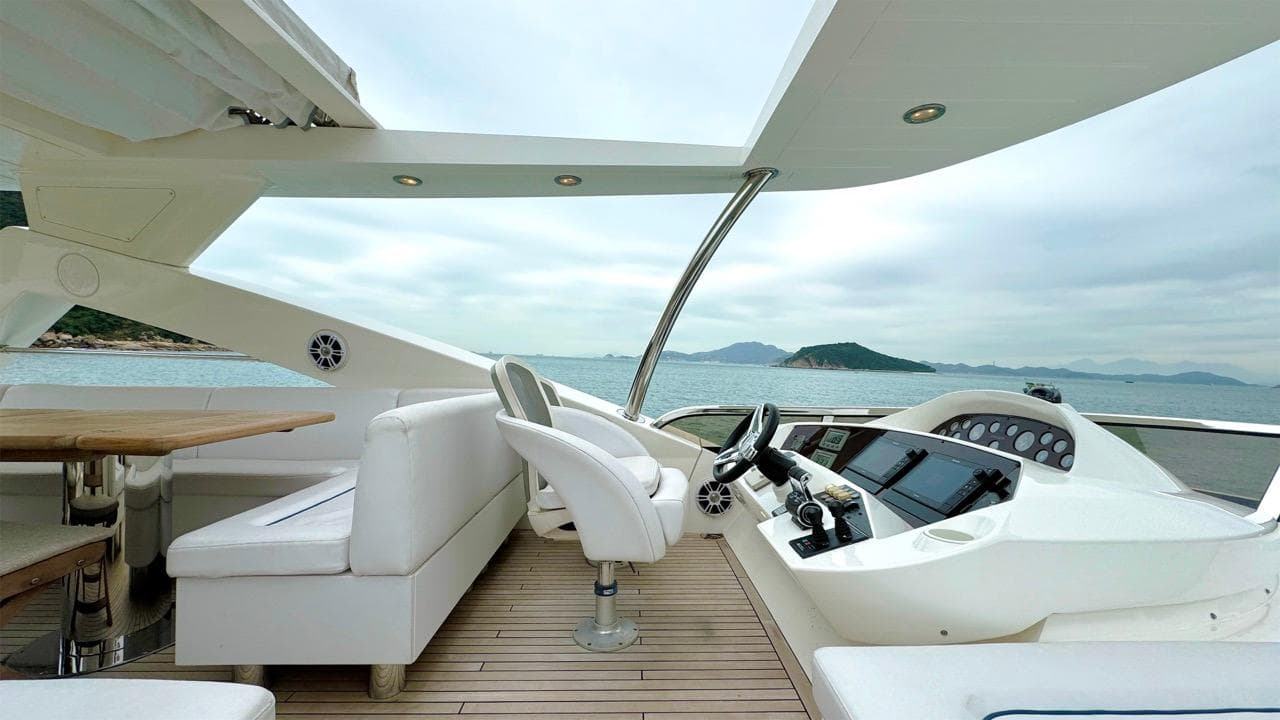 Luxurious 2009 Sunseeker 86 Yacht deck with modern seating and ocean view.