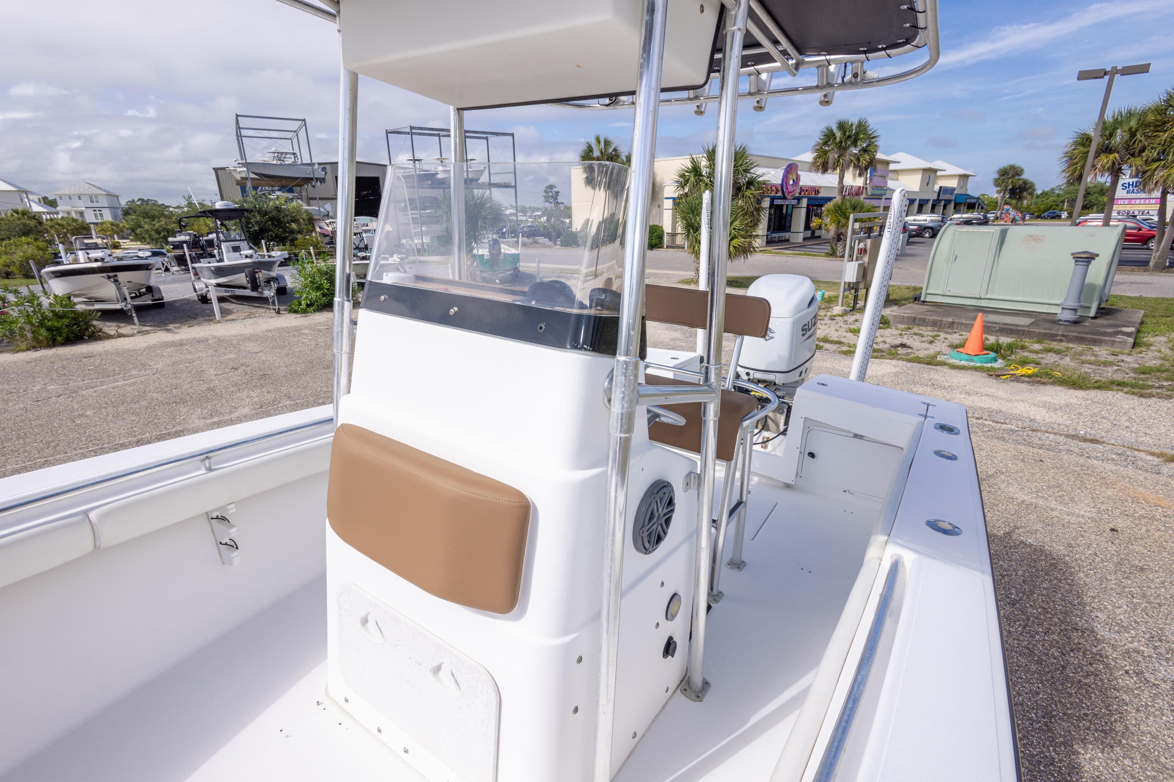 2004 Sea Craft 23 CC boat with center console and seating, parked outdoors.