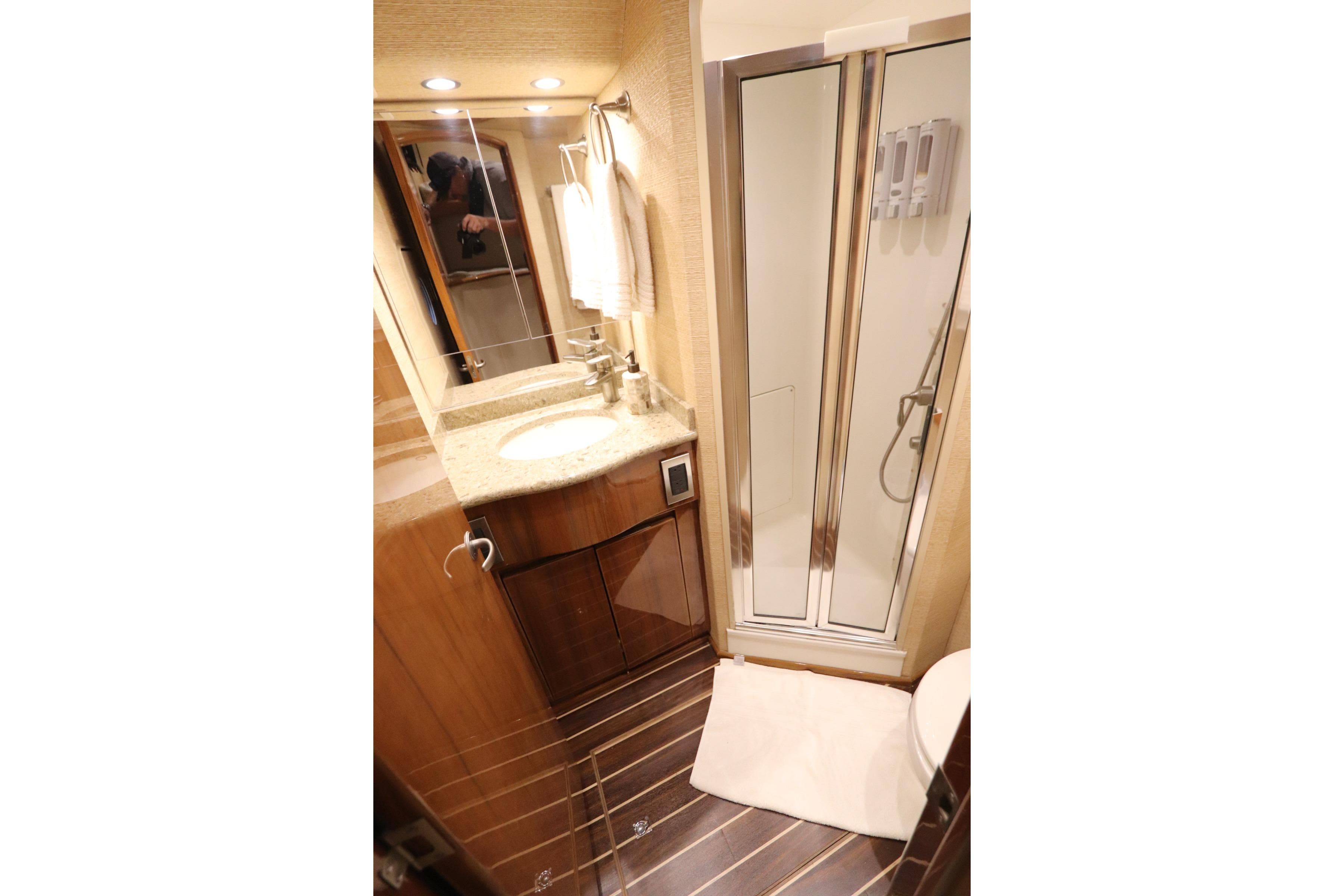 Luxurious bathroom in 2013 Viking 66 yacht with modern fixtures and shower.