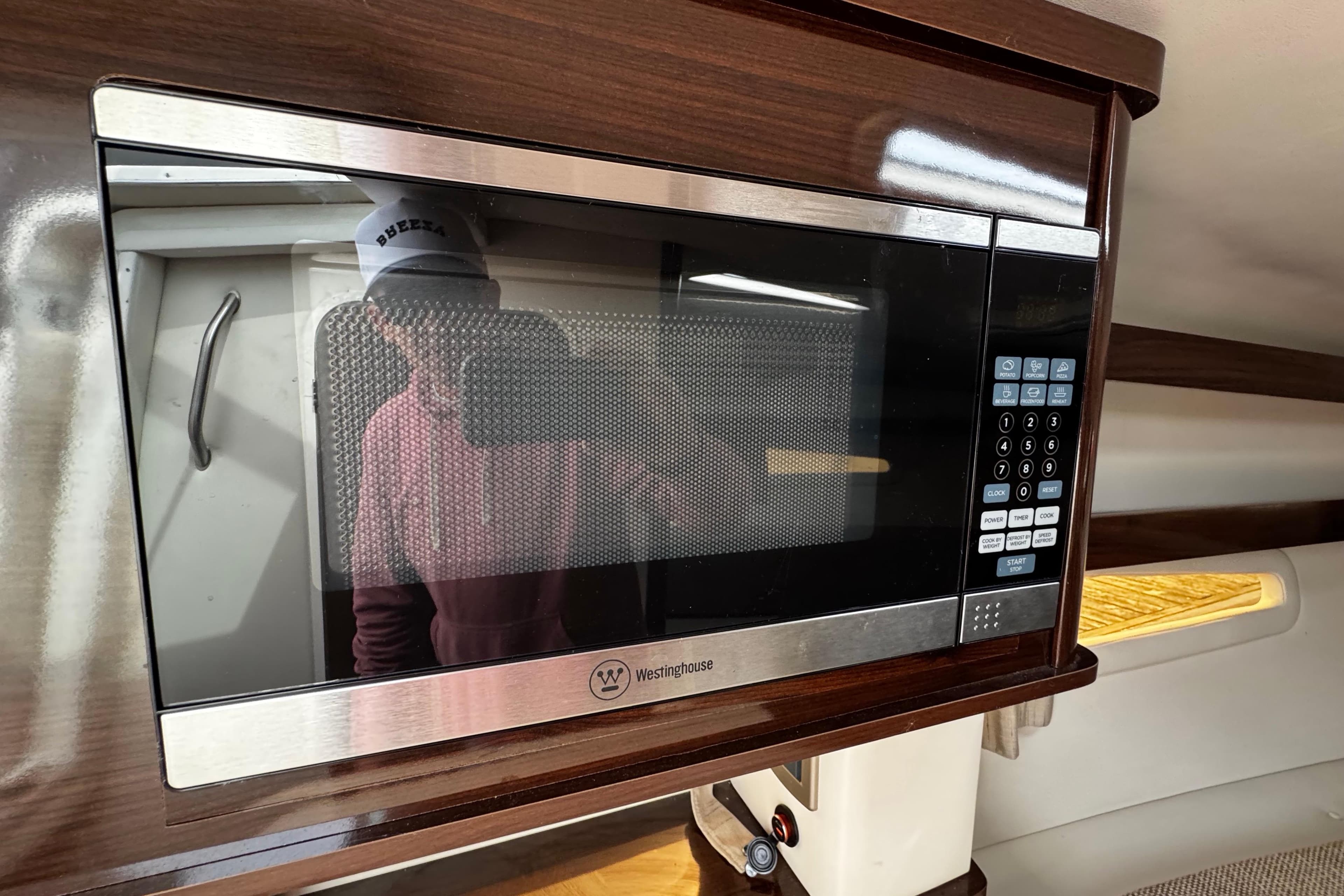 Microwave in 2016 Sea Ray Sundancer 260 cabin, featuring sleek design and modern controls.